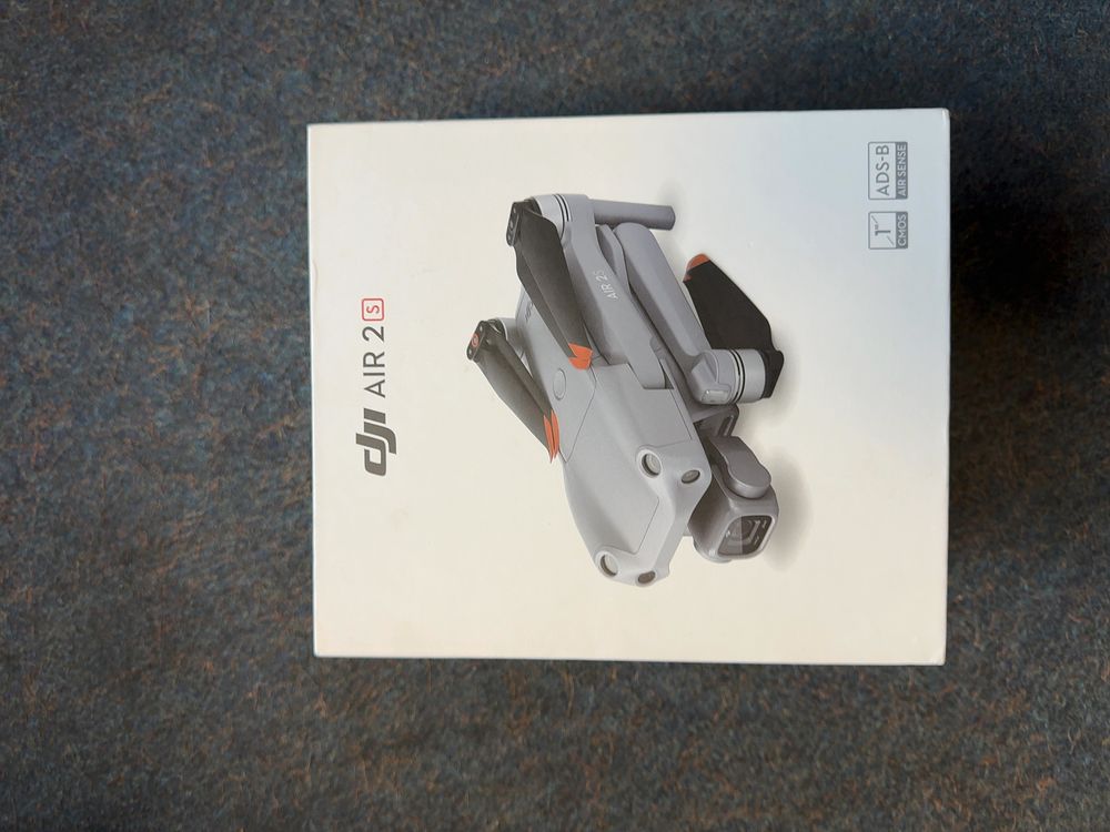 Lot 416: A DJI Camera Drone and Accessories in Box