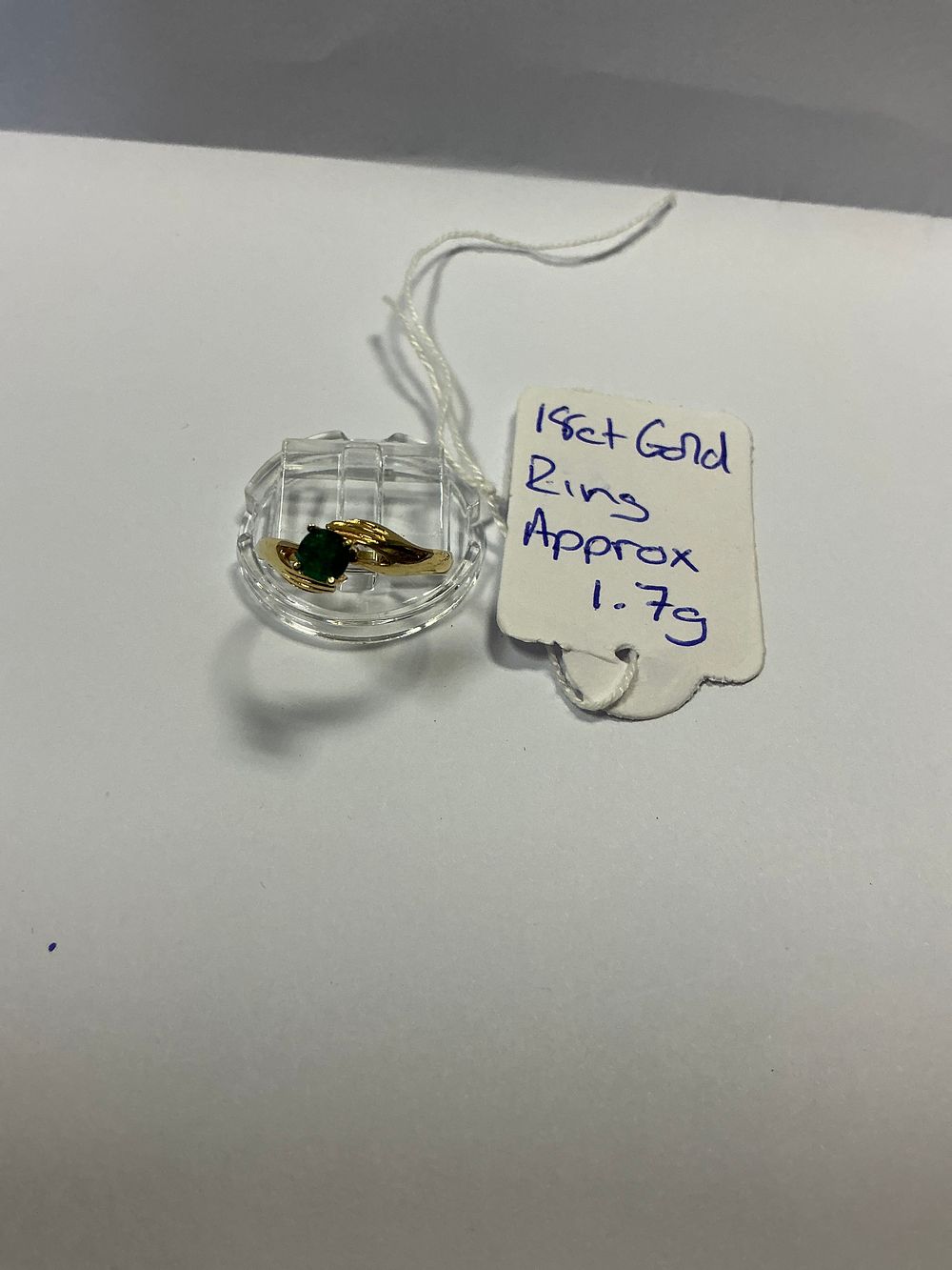 Lot 122: An 18ct Yellow Gold Bypass Style Ring Set with a Natural Colombian Emerald