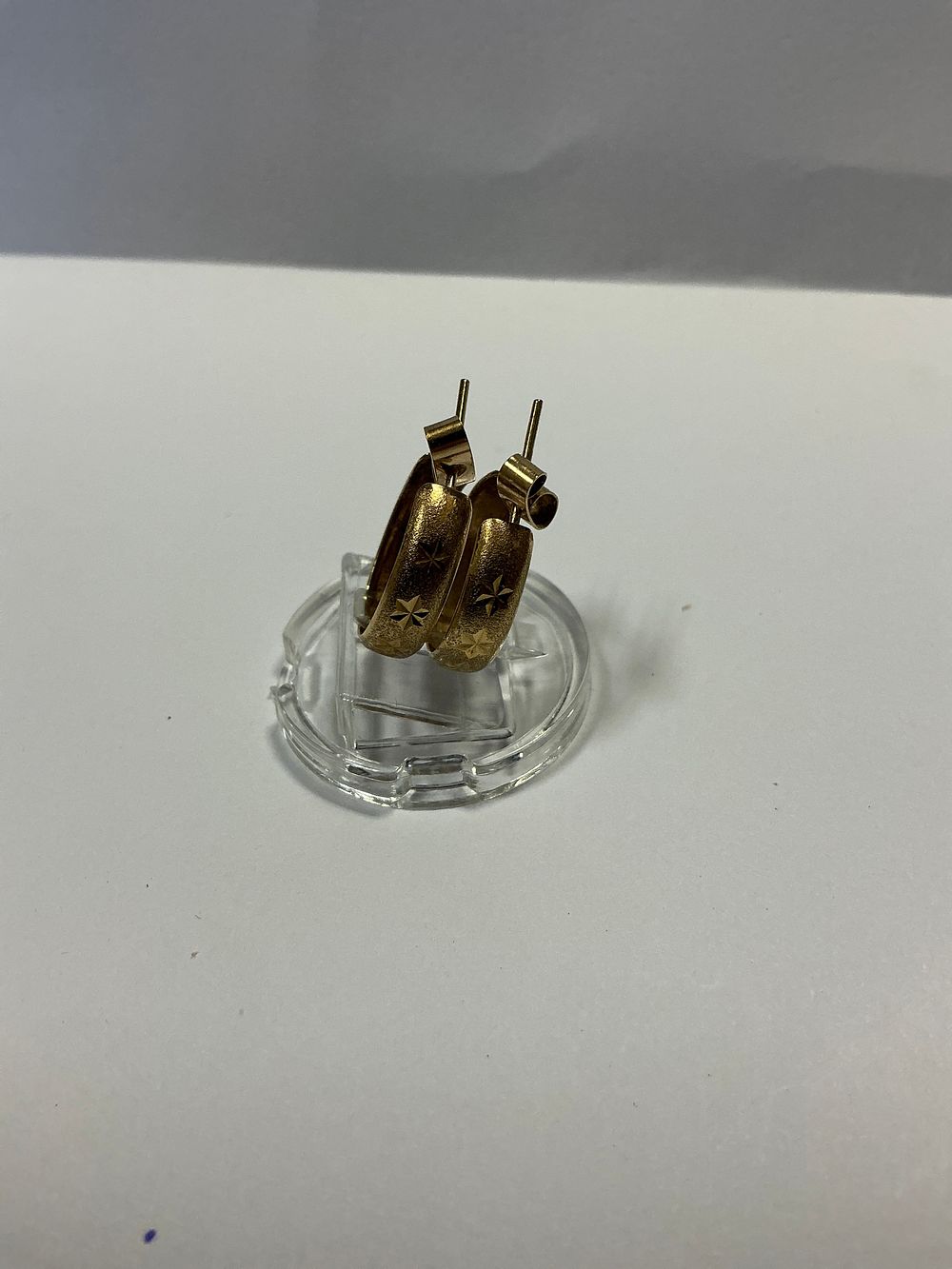 Lot 124: A Pair of Small Textured 9ct Yellow Gold Hoop Earrings