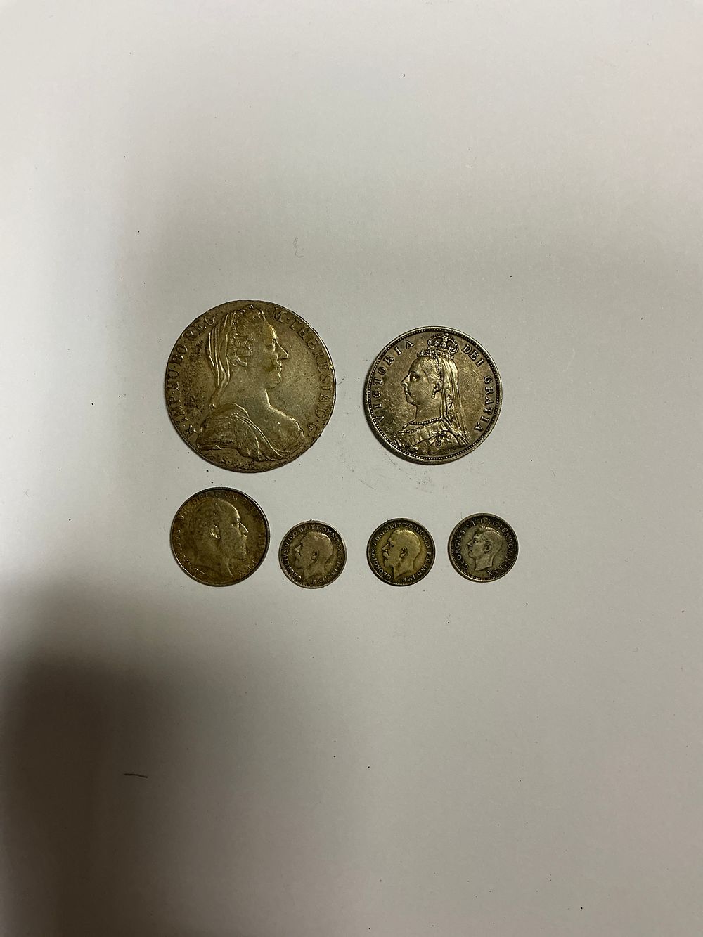 Lot 155: A Collection of British and Austrian Silver and Silver Alloy Coins Including a Maria Theresa Thaler
