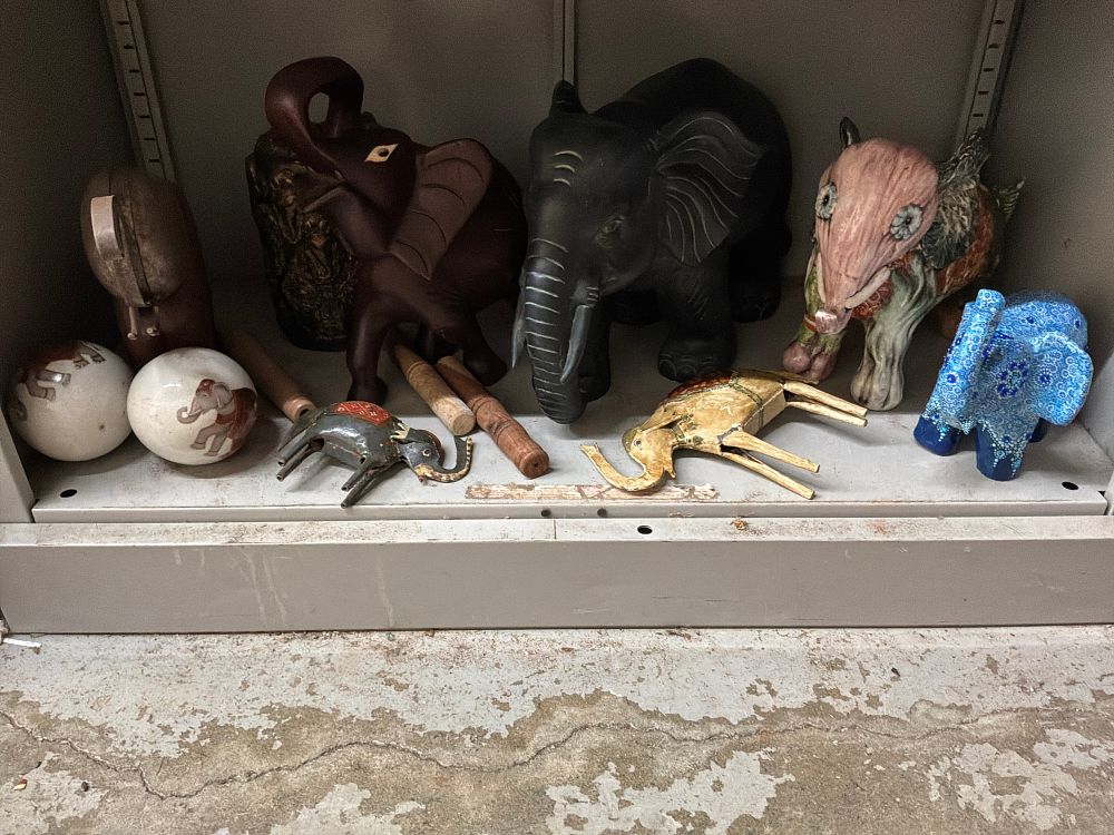 Lot 24: A Collection of Elephant Figurines and Decorative Objects in Various Styles and Materials