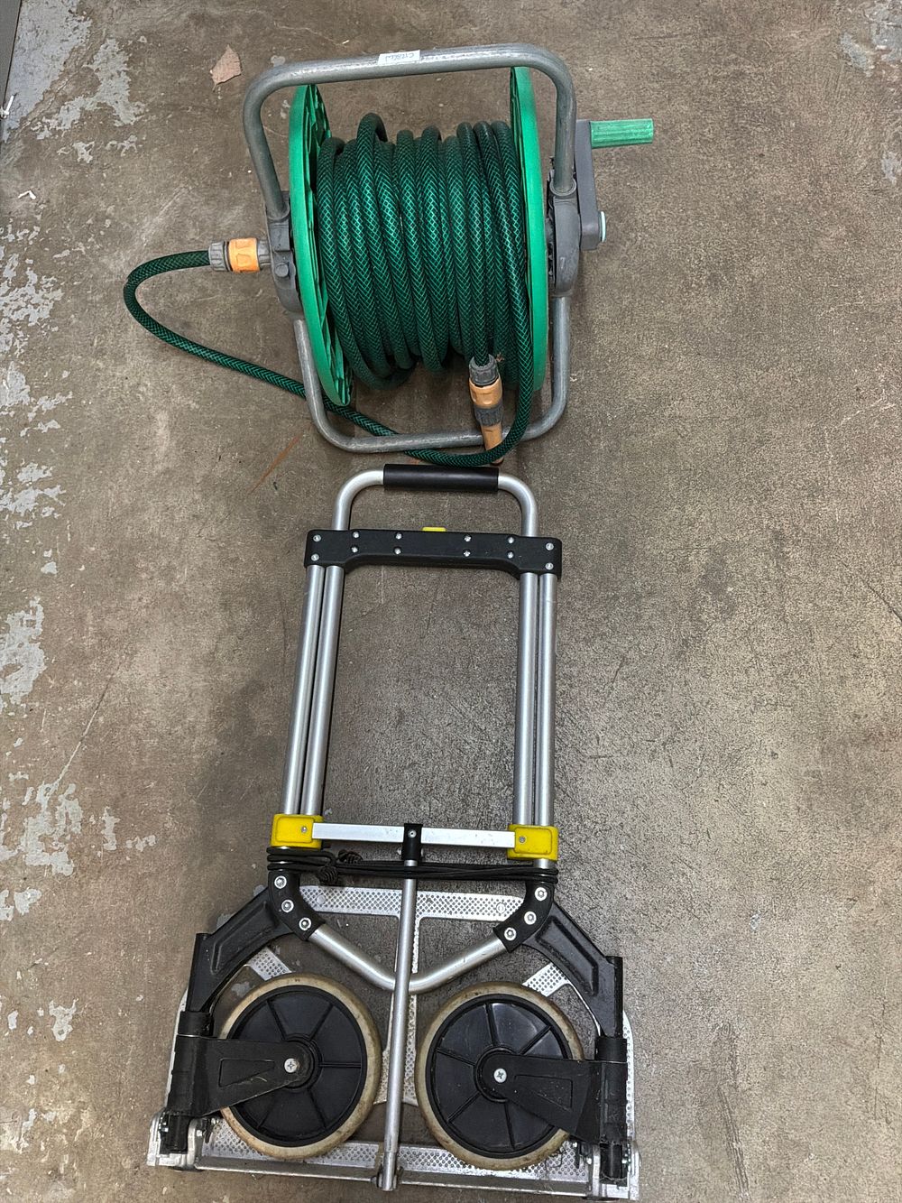 Lot 30: A Pair of Utility Items Comprising a Manual Garden Hose Reel and a Folding Hand Truck