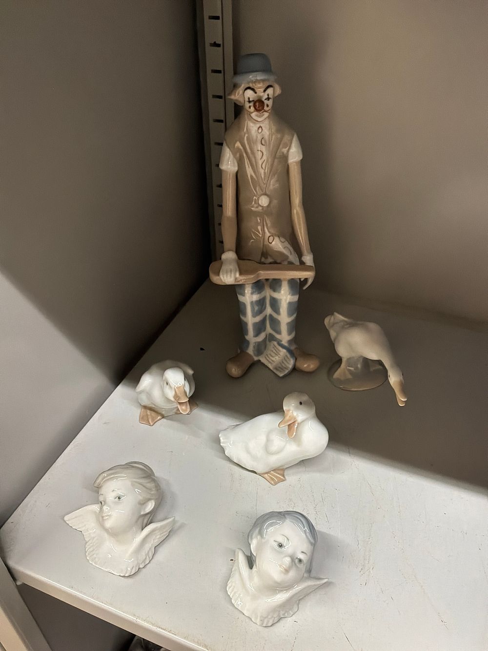 Lot 34: A Collection of Spanish Porcelain Figurines and Wall Plaques including Lladro and Nao Examples
