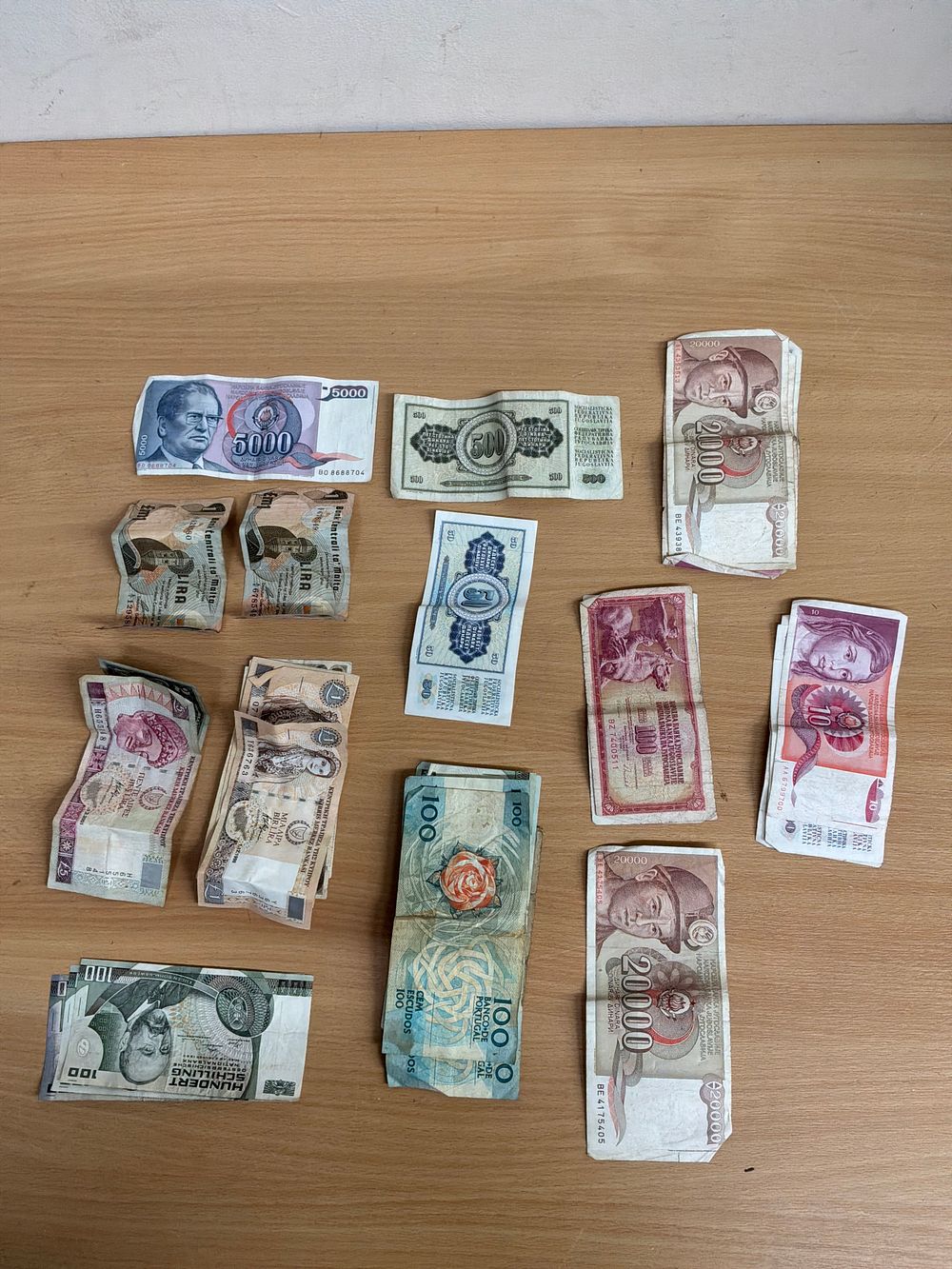 Lot 63: A Collection of European Banknotes Including Yugoslavian, Portuguese, and Cypriot Examples