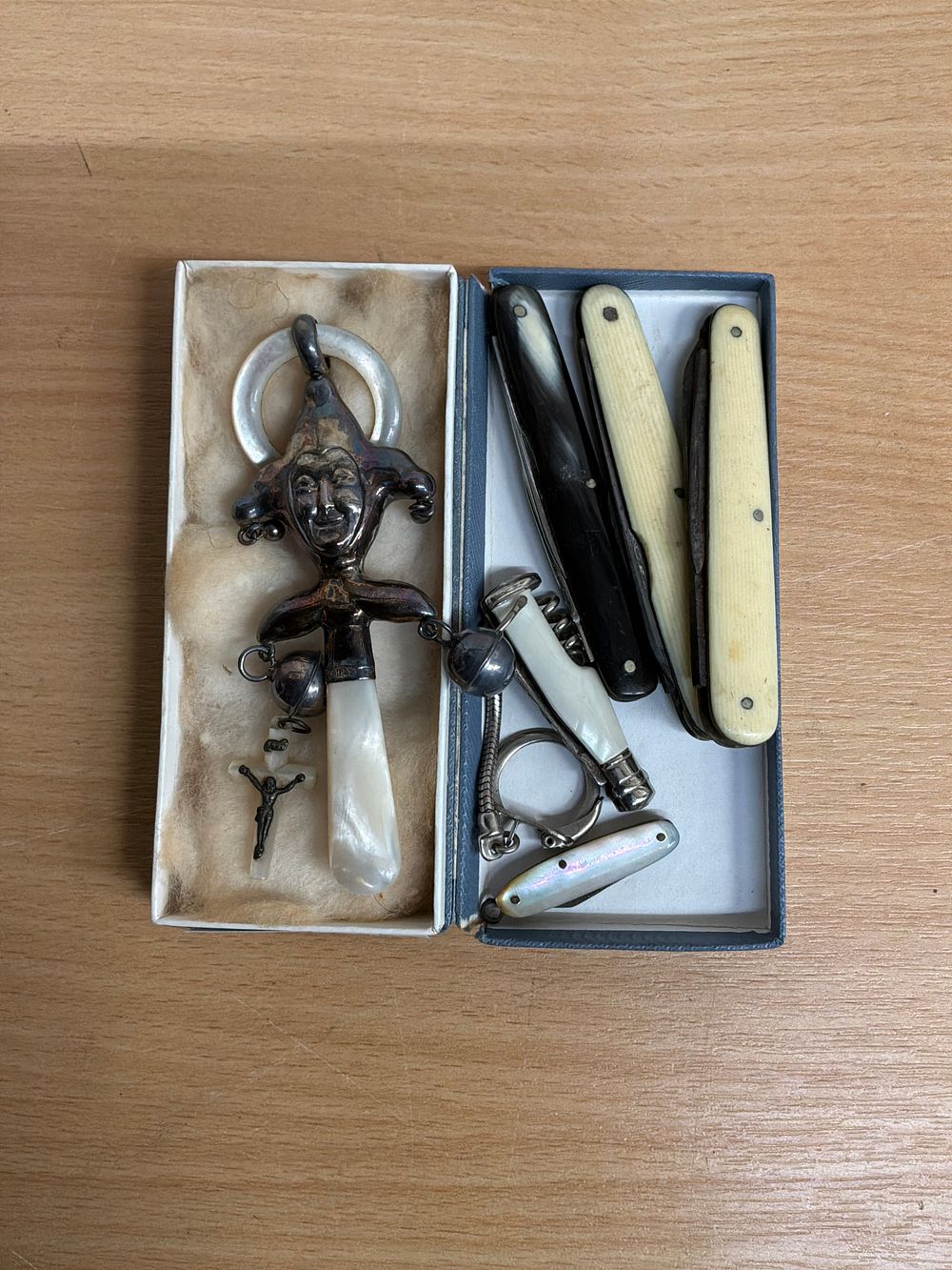 Lot 68: A Collection of Folding Pocket Knives and a Hallmarked Silver Figural Baby Rattle