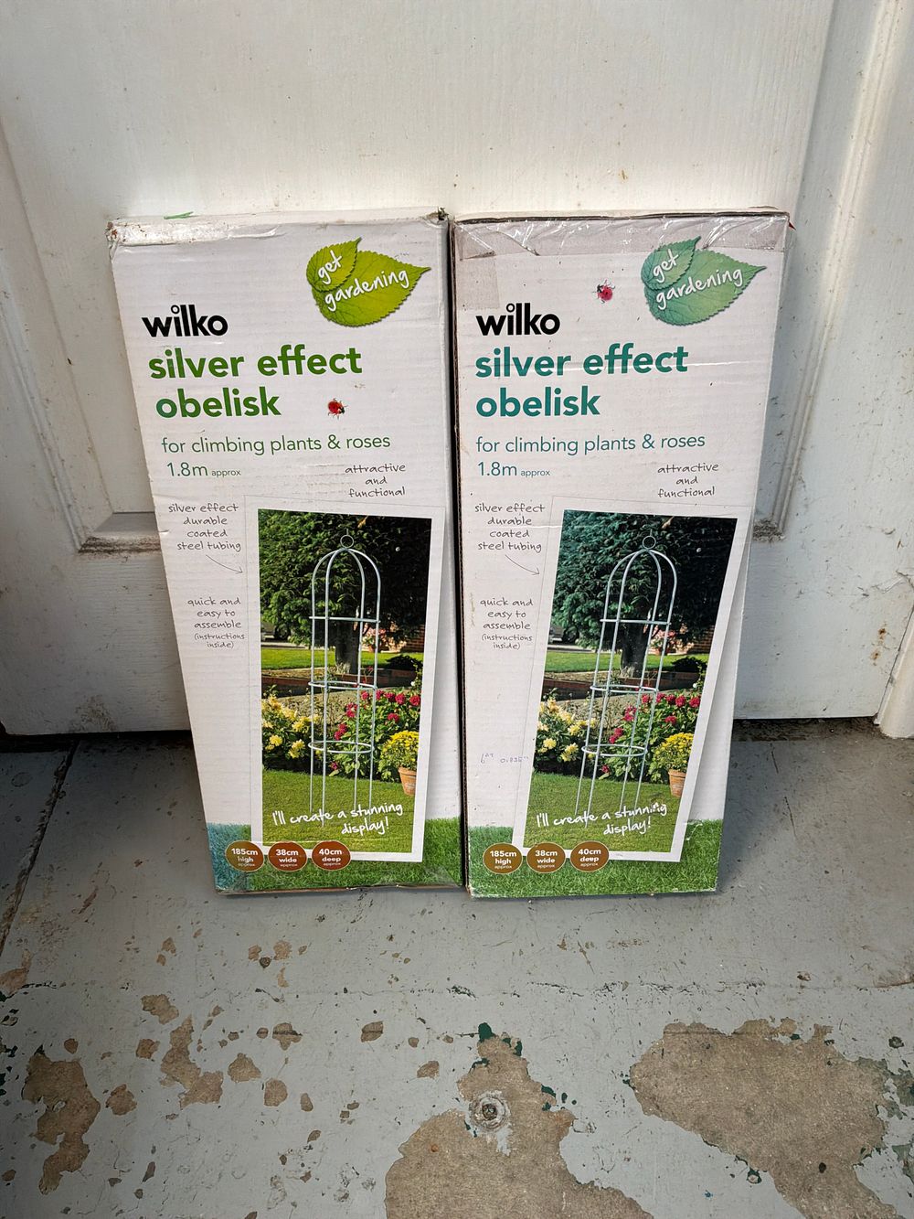 Lot 91: A Pair of Wilko Silver Effect Coated Steel Garden Obelisks