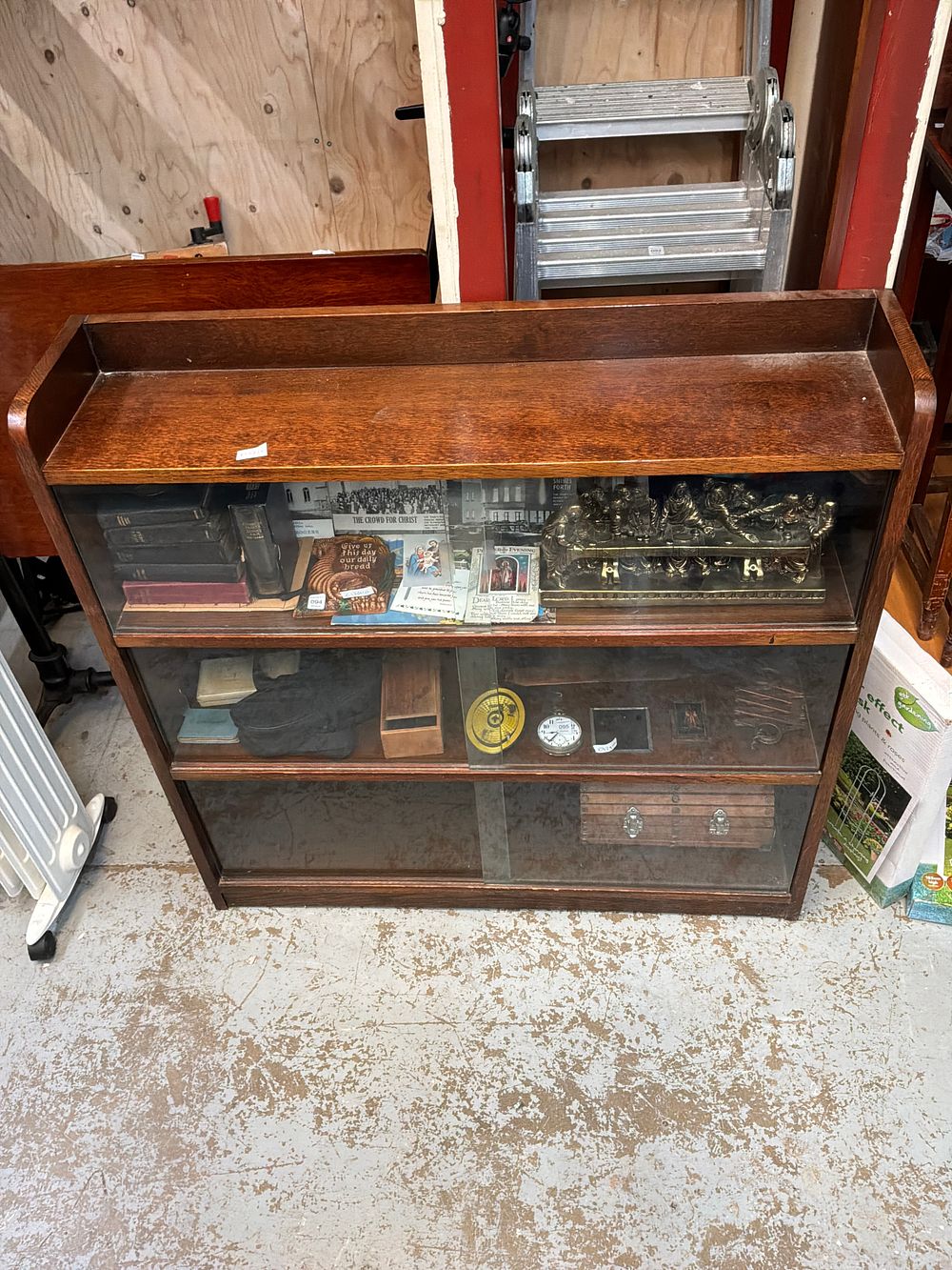 Lot 100: A Mid-Century Oak  Display Cabinet with Sliding Glass Doors