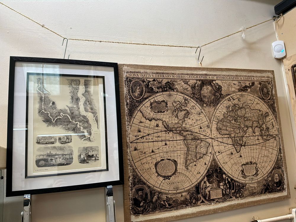 Lot 107: Two Cartographic Prints Including a Reproduction World Map and a Framed River Thames Map