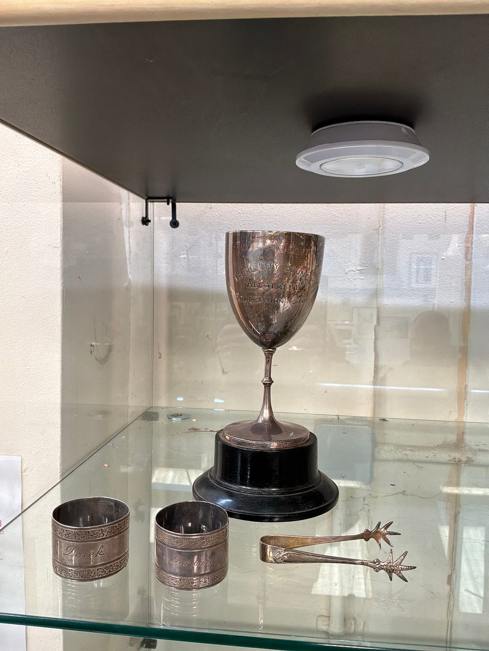 Lot 180: A Group of Silver Tableware including a Truro City Council Allotment Competition Cup and Bird-Claw Tongs
