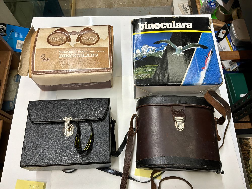 Lot 191: A Collection of Four Sets of Vintage Binoculars Including Ross London, Sears, and Sunagor Examples