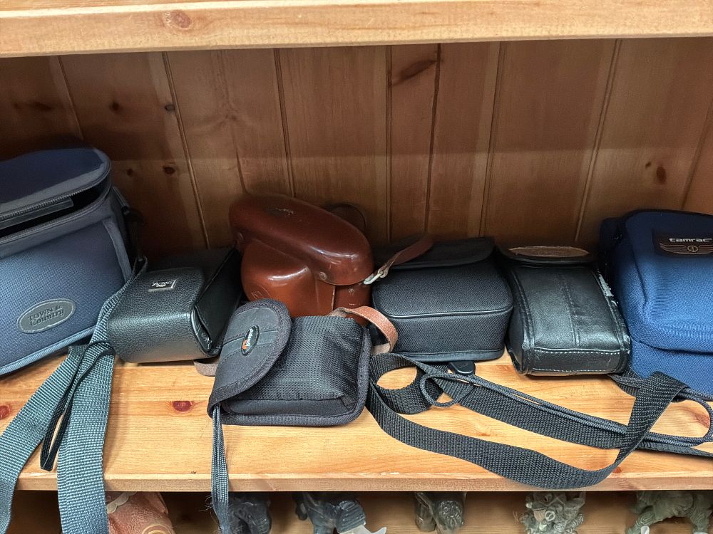 Lot 199: A Collection of Vintage Film and Digital Cameras with Binoculars and Carrying Cases Including Agfa and Nikon Examples