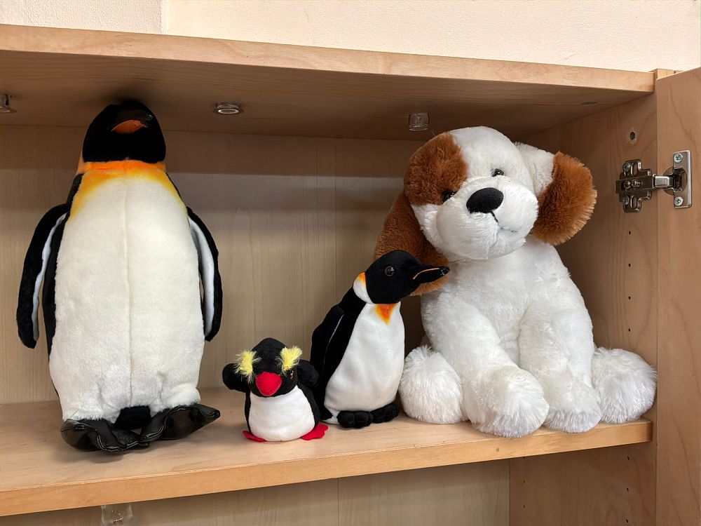 Lot 219: A Collection of Stuffed Plush Animal Toys Including Penguin and Dog Figures