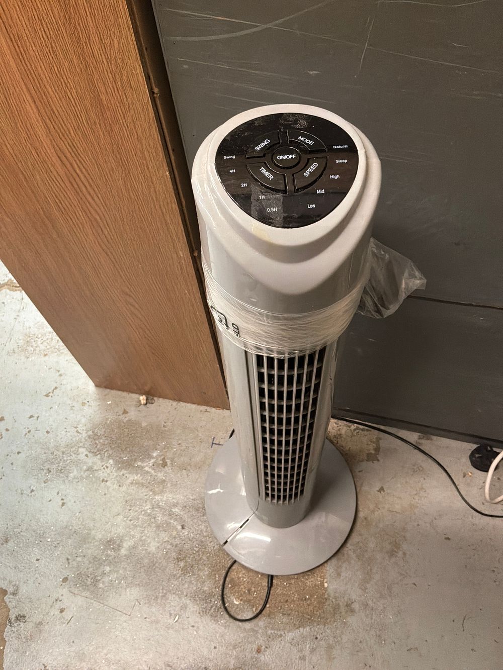 Lot 228: An Electric Oscillating Tower Fan with Five Button Control Panel