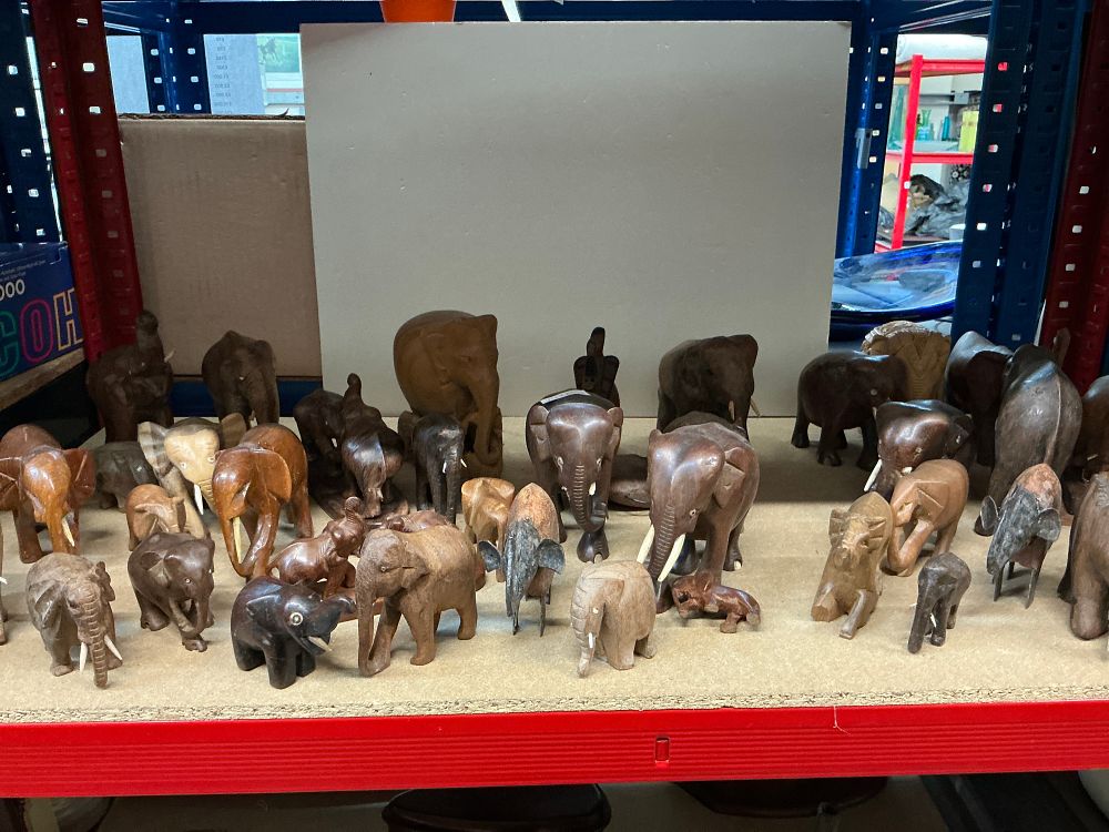 Lot 252: A Collection of Carved Wooden Elephant Figurines in Various Sizes and Styles