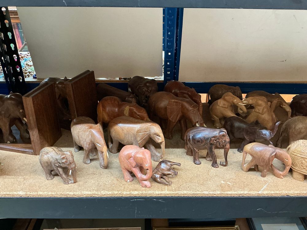 Lot 261: A Collection of Carved Wood and Stone Elephant Figurines and Bookends