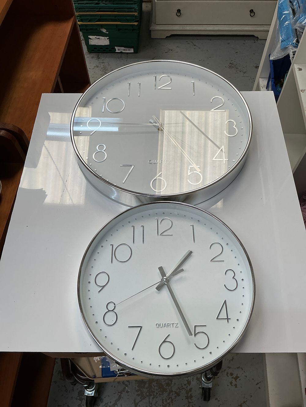 Lot 310: A Pair of Contemporary Silver Tone Quartz Wall Clocks