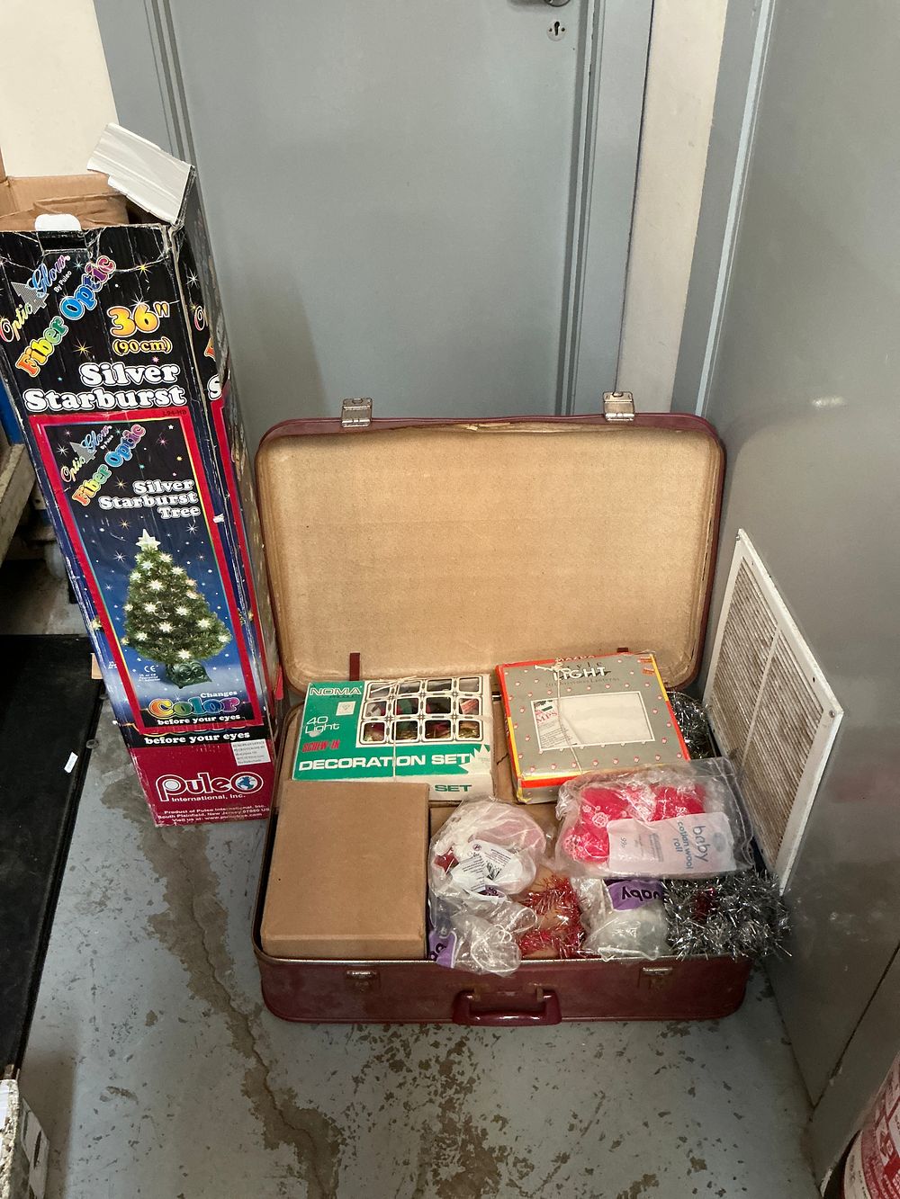Lot 311: A Collection of Vintage Christmas Decorations and Fiber Optic Tree in Suitcase Including Noma and Mazda Examples