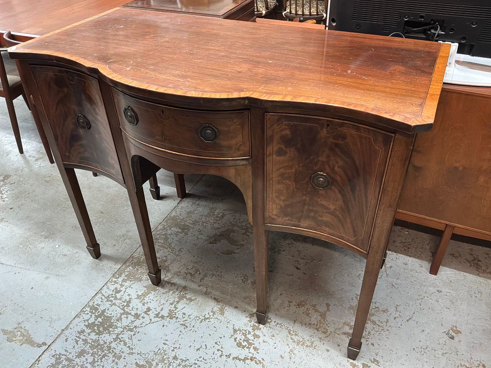 Lot 343: A George III Style Serpentine Front Mahogany Sideboard with Satinwood Crossbanding and Inlaid Stringing