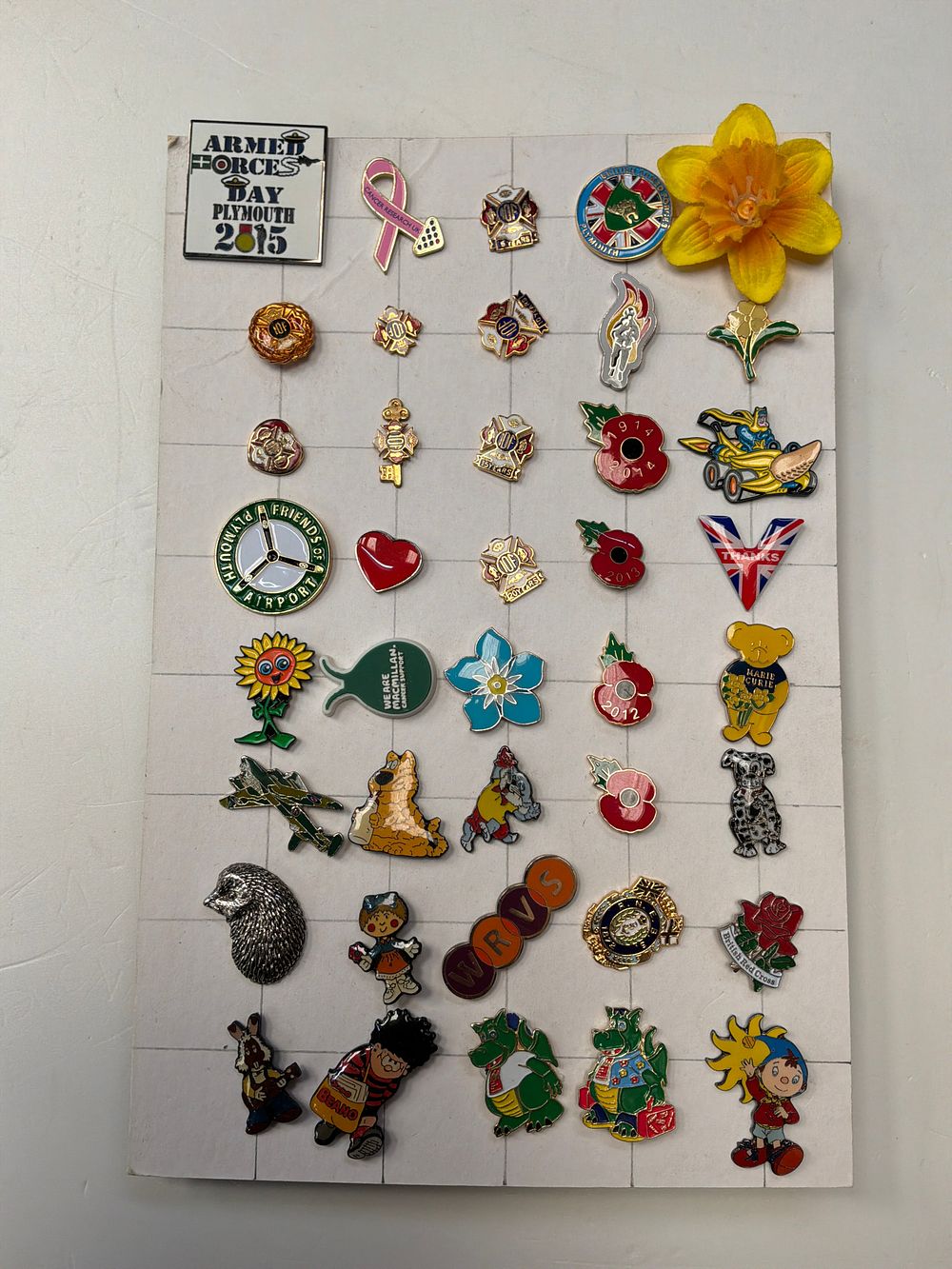 Lot 364: A Collection of Enamel and Metal Lapel Pins and Badges Including Marie Curie and Beano Examples
