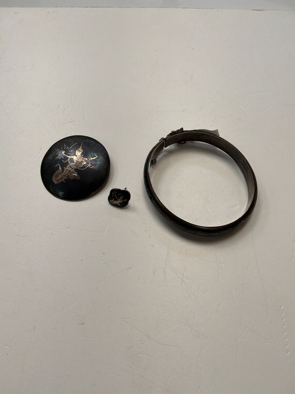 Lot 373: A Trio of Siam Sterling Silver and Niellowork Jewellery Items Including a Bangle and Brooch