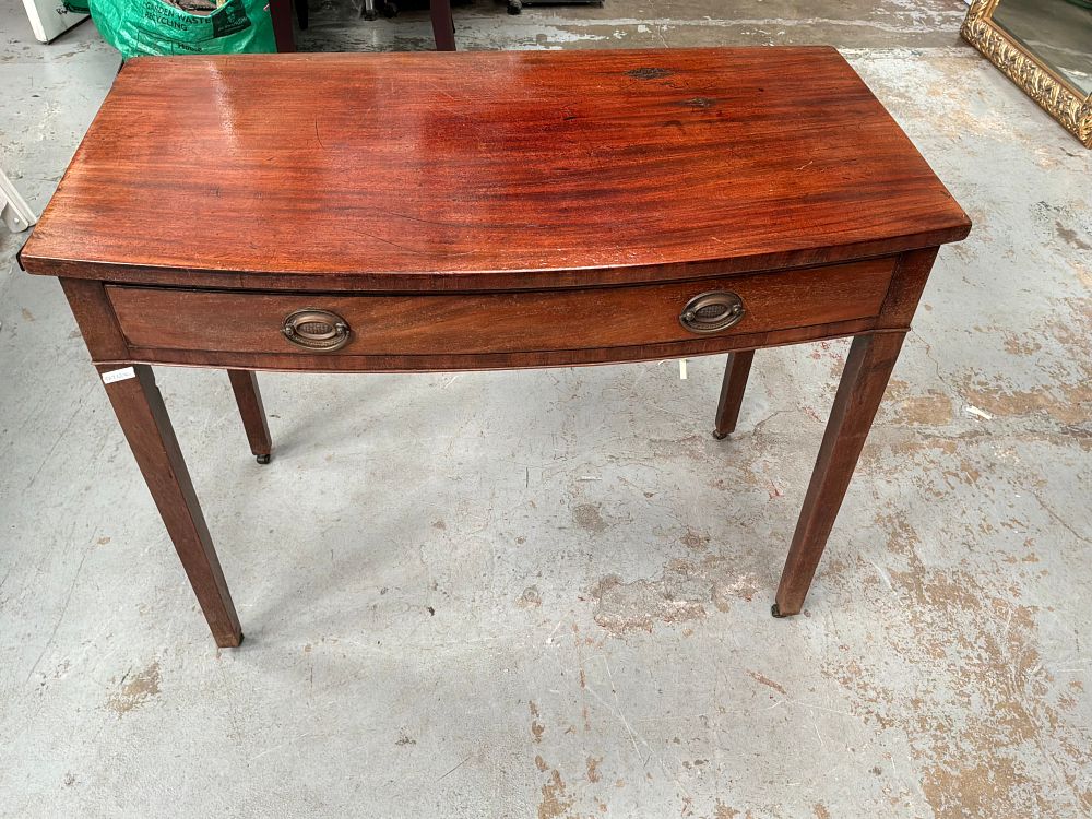Lot 393: A Georgian Style Mahogany Bow Fronted Side Table with Tapered Legs