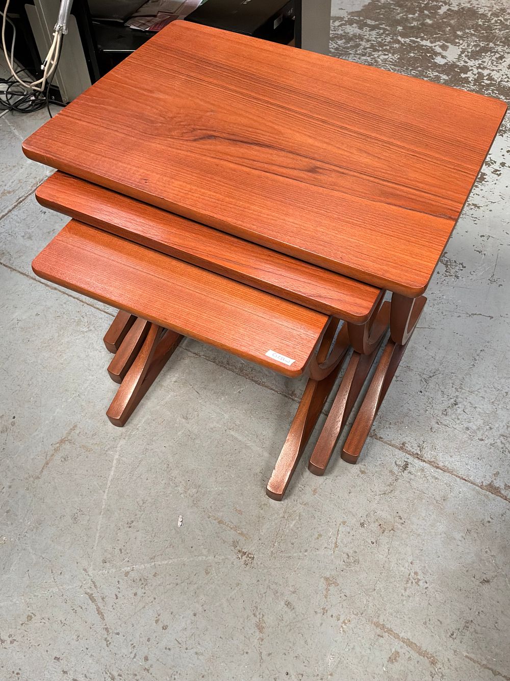 Lot 404: A Trio of Mid-Century Modern Teak Nesting Tables by Nathan Furniture