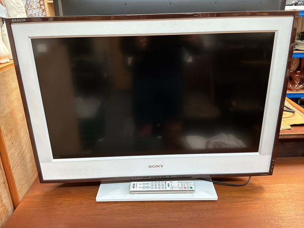 Lot 406: A Sony Bravia Picture Frame LCD Digital Colour Television with Remote Control and Pedestal Stand