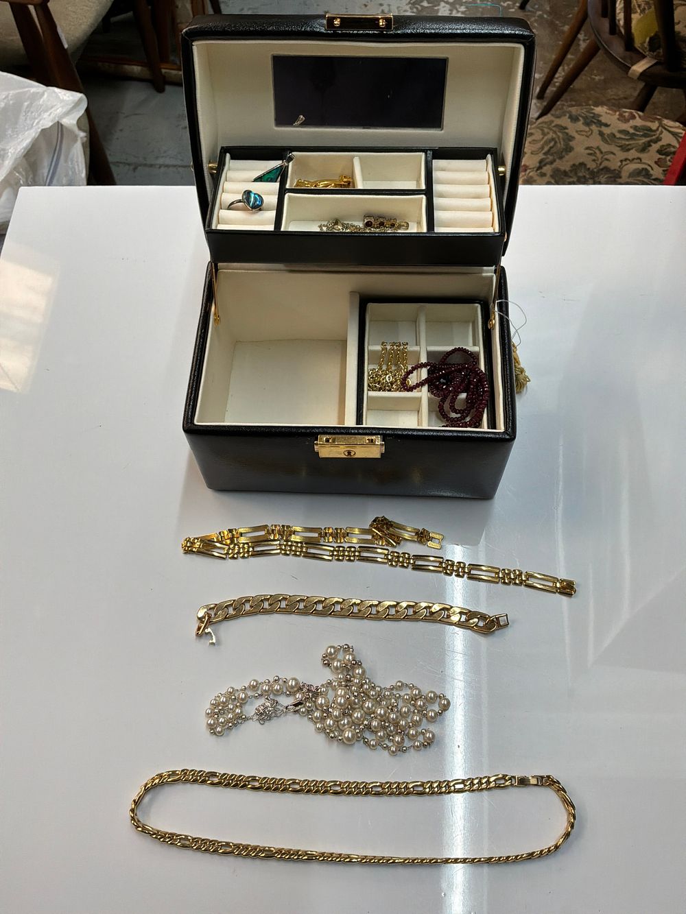 Lot 431: A Collection of Yellow and Silver Toned Jewellery and Accessories in a Faux Leather Presentation Case