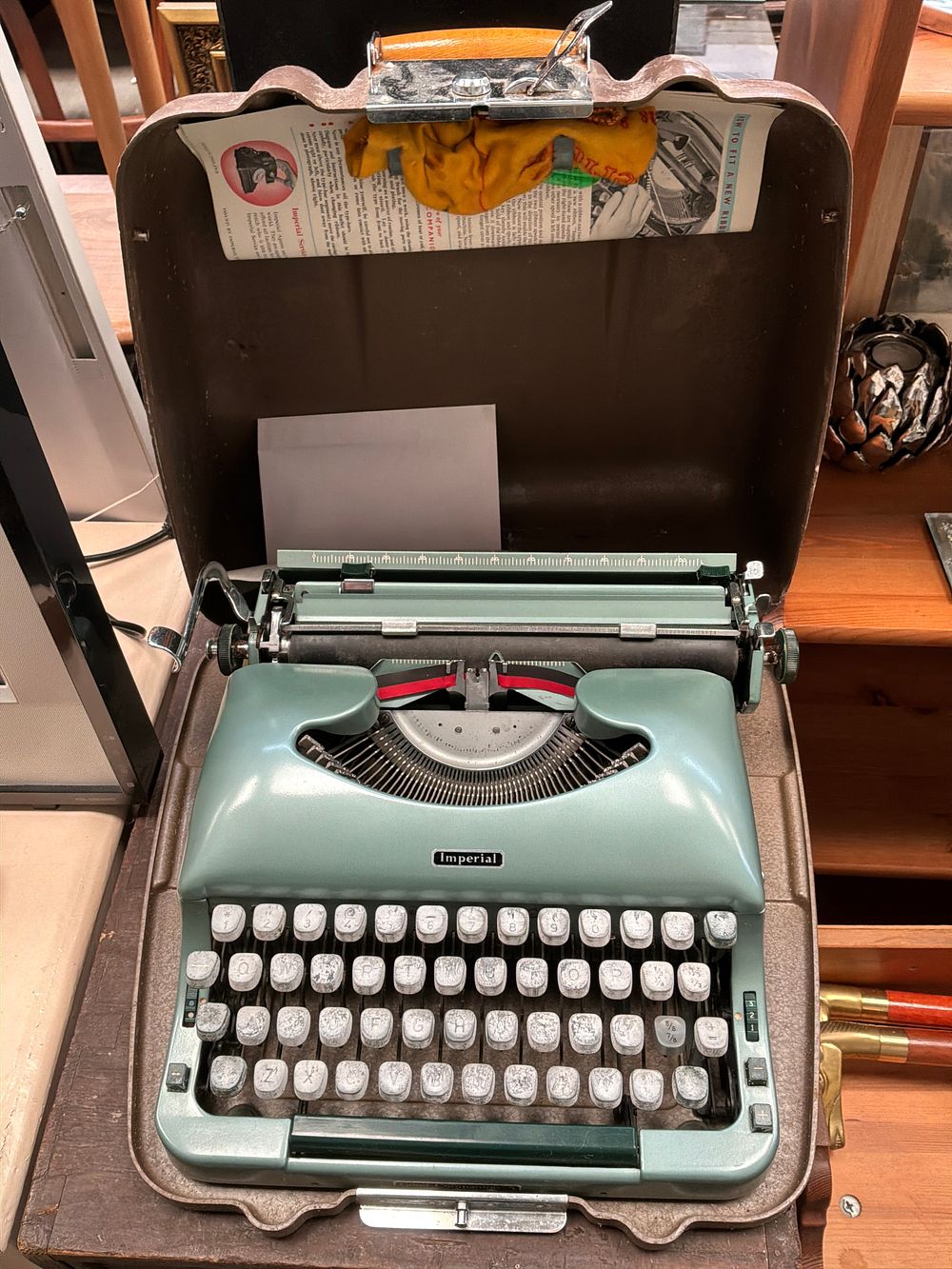 Lot 461: An Imperial Manual Portable Typewriter in Seafoam Green with Carrying Case