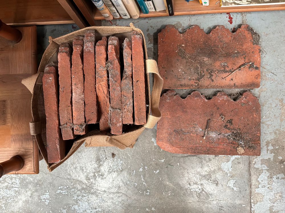Lot 491: A Collection of Reclaimed Victorian Style Terracotta Garden Edging Tiles