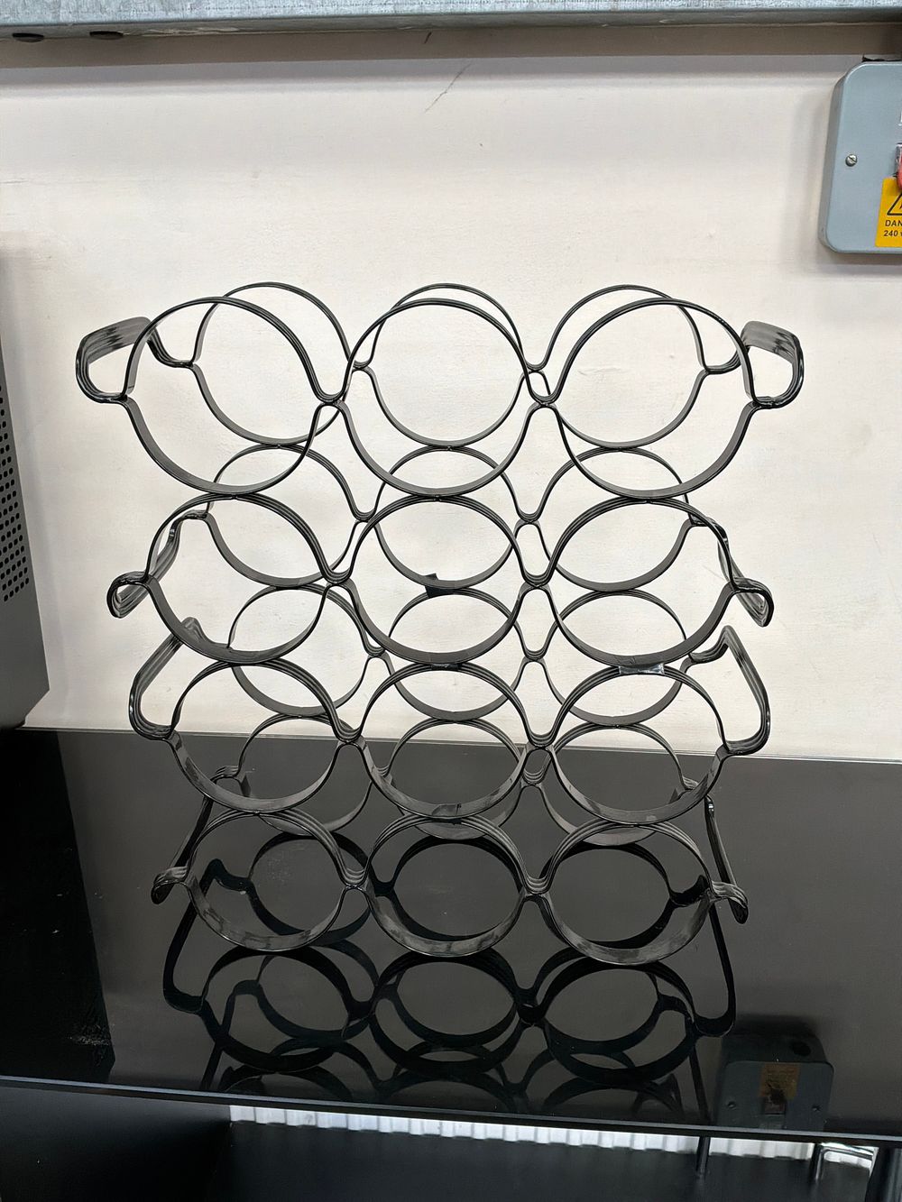 Lot 507: A Contemporary Black Plastic Nine Bottle Modular Wine Rack
