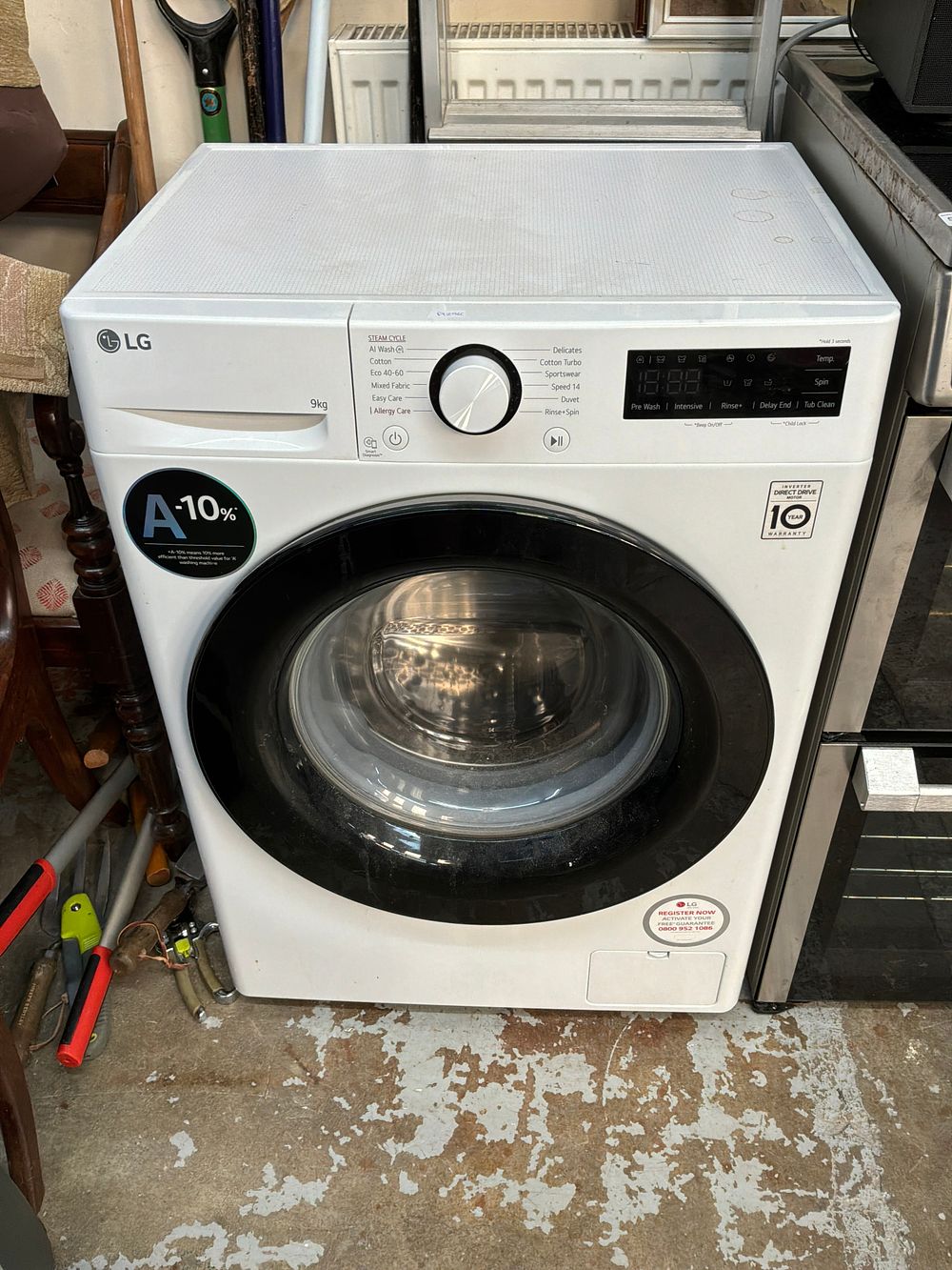 Lot 525: An LG 9kg Front Loading Washing Machine with AI Wash and Steam Cycles