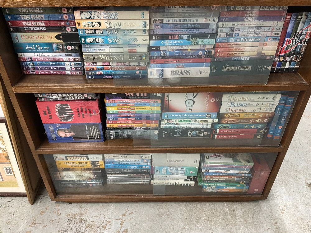 Lot 551: A Collection of Television Series DVD Box Sets in a Wooden Cabinet Including HBO and BBC Examples