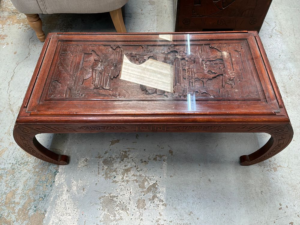 Lot 454: A Mid-20th Century Chinese Export Style Carved Hardwood Coffee Table with Glass Top