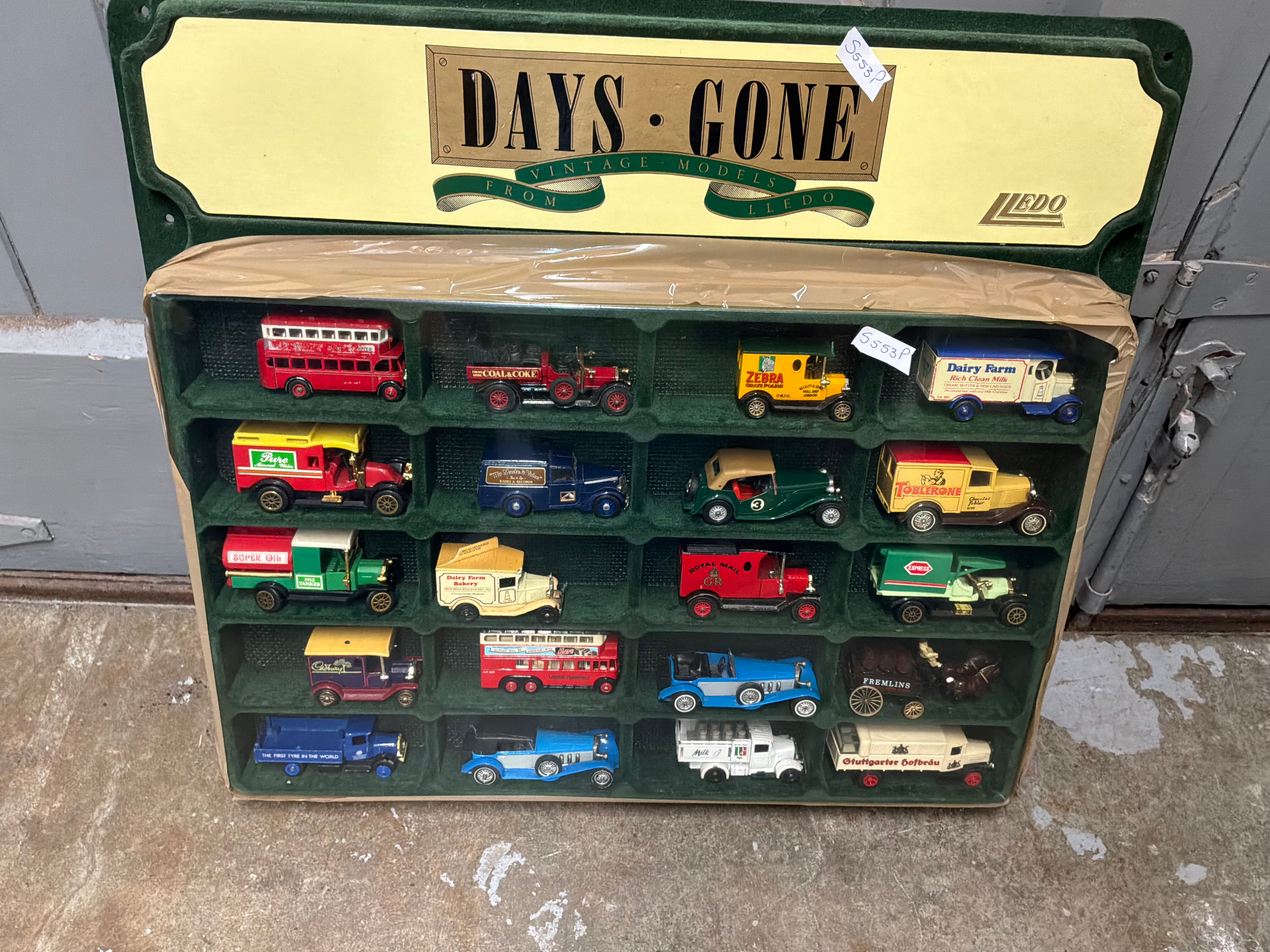 A Set of Twenty Lledo Days Gone Die-Cast Model Vehicles in Wall Display Case