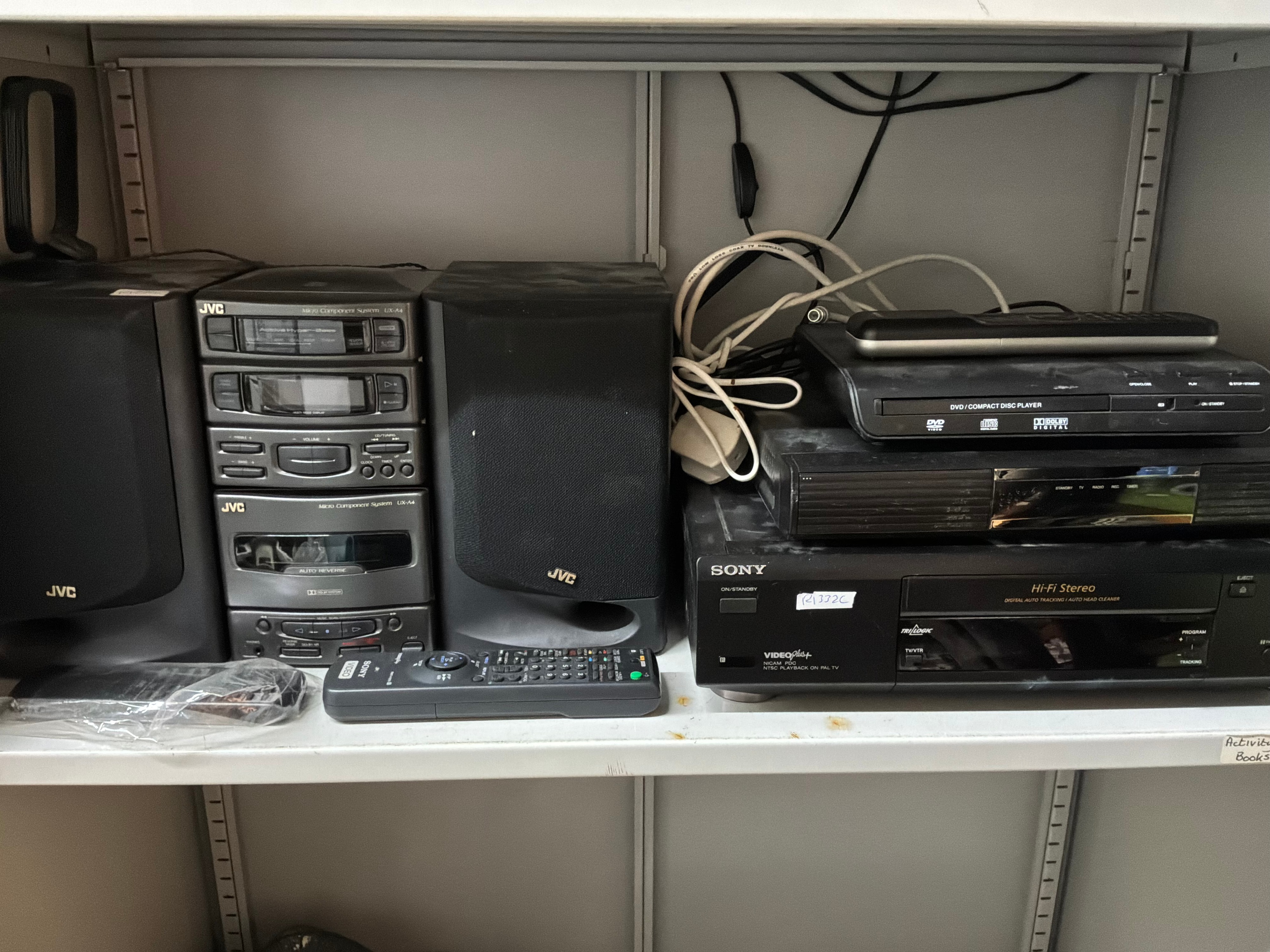 A Collection of Vintage Home Entertainment Electronics Including Sony and JVC Examples