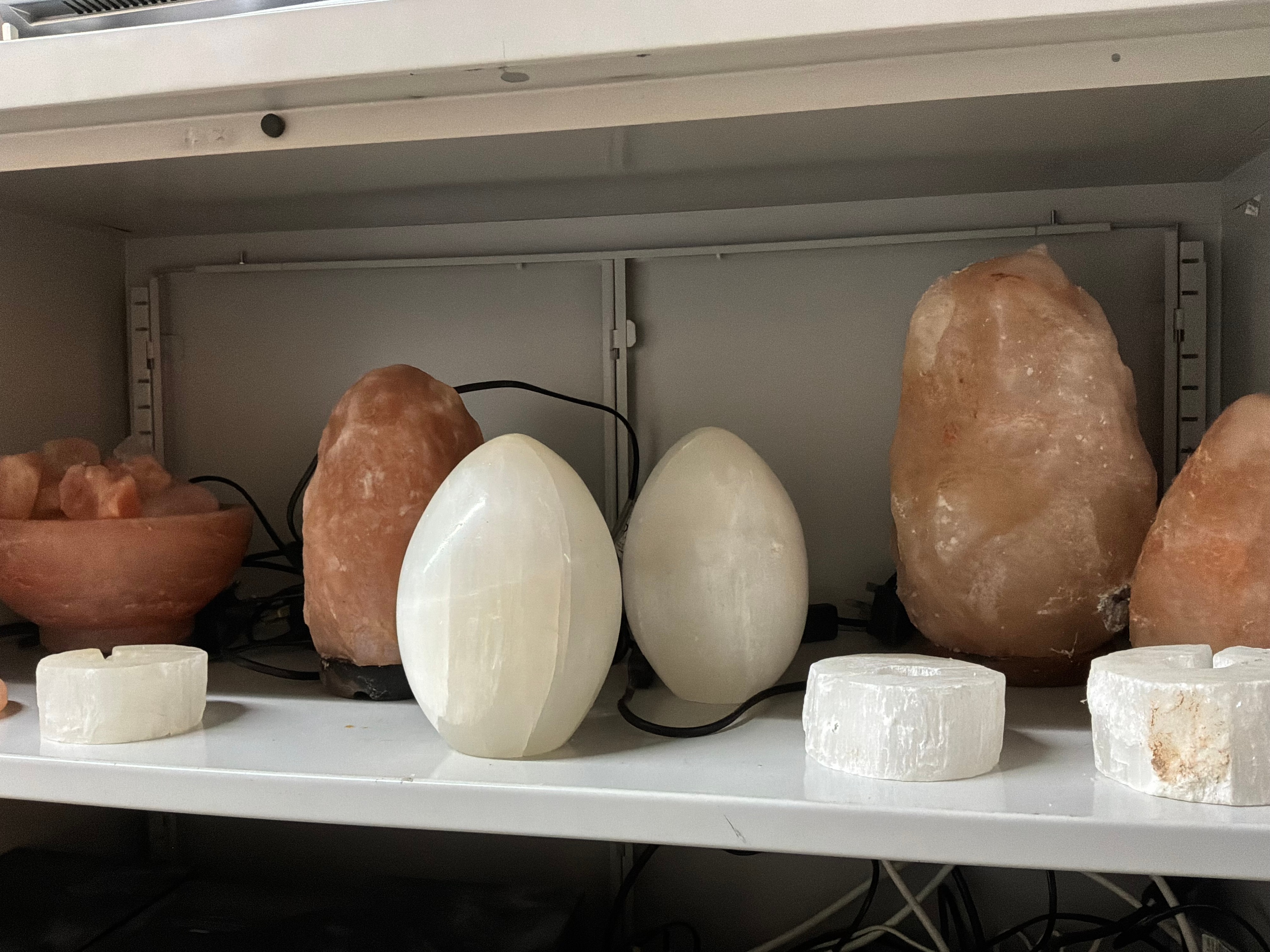 A Collection of Himalayan Salt and Selenite Stone Table Lamps and Decorative Candle Holders