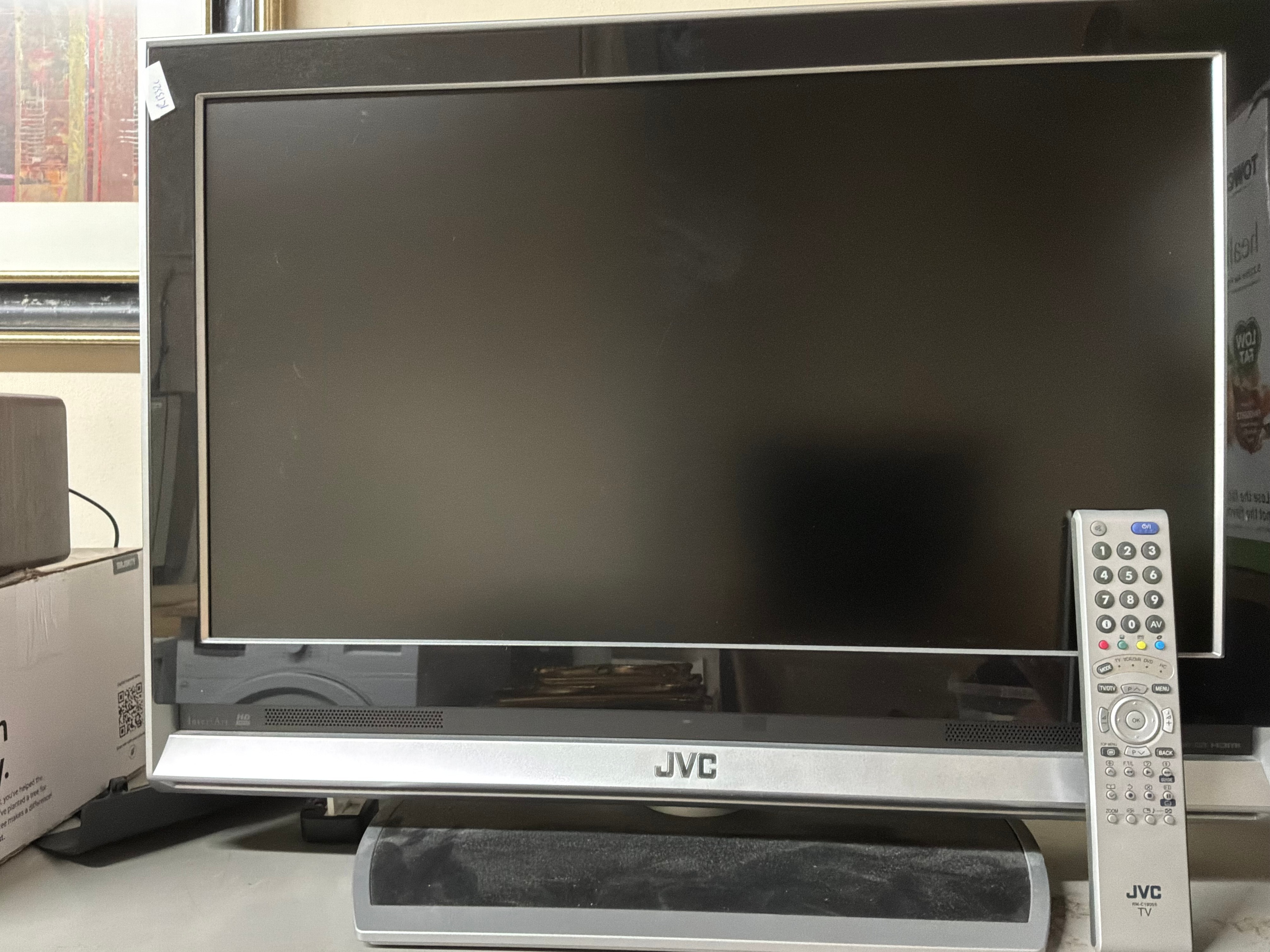 A JVC HD Ready Television With Remote Control