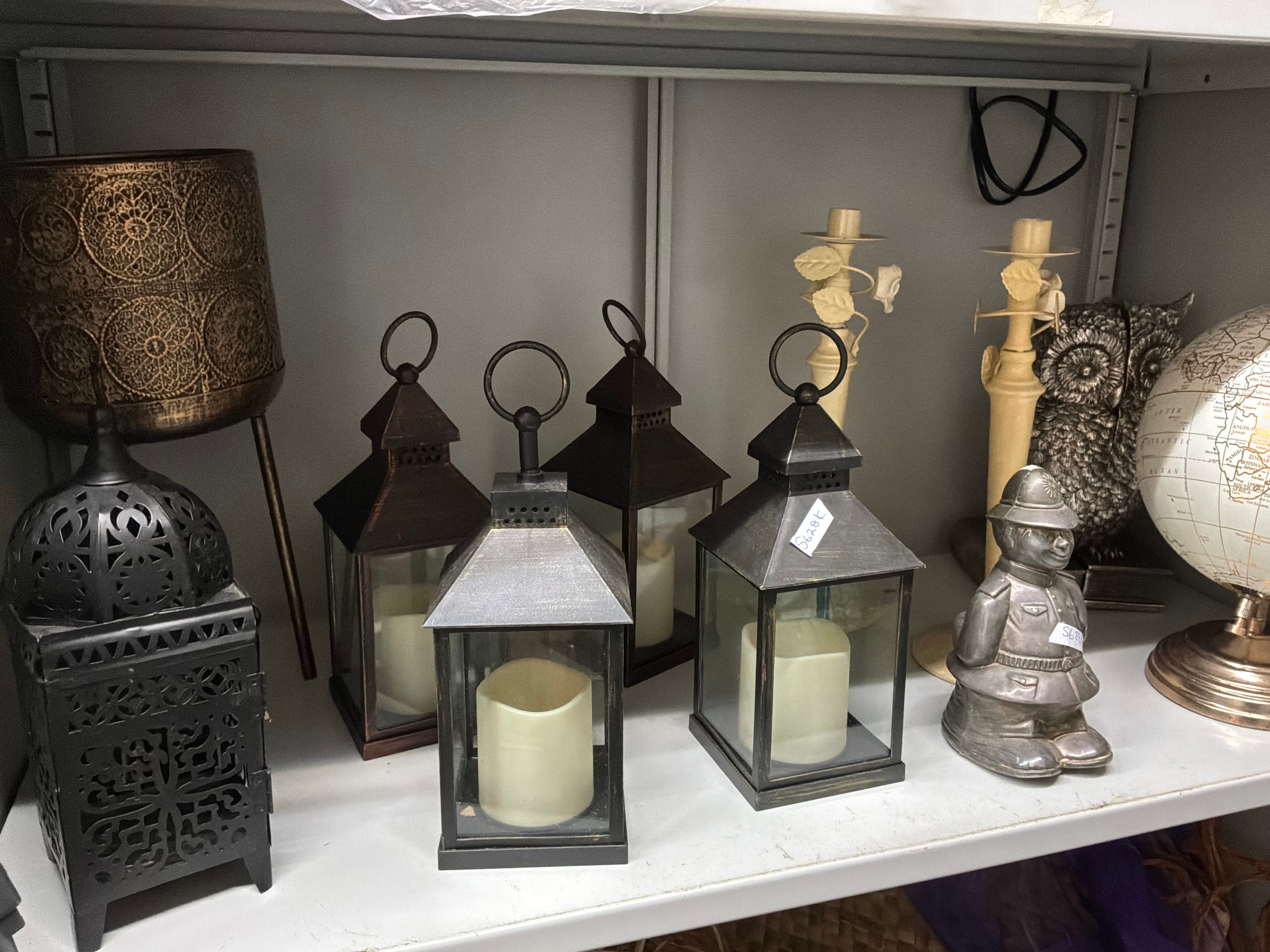 A Collection of Assorted Contemporary Home Decorative Items Including Lanterns and a Terrestrial Globe