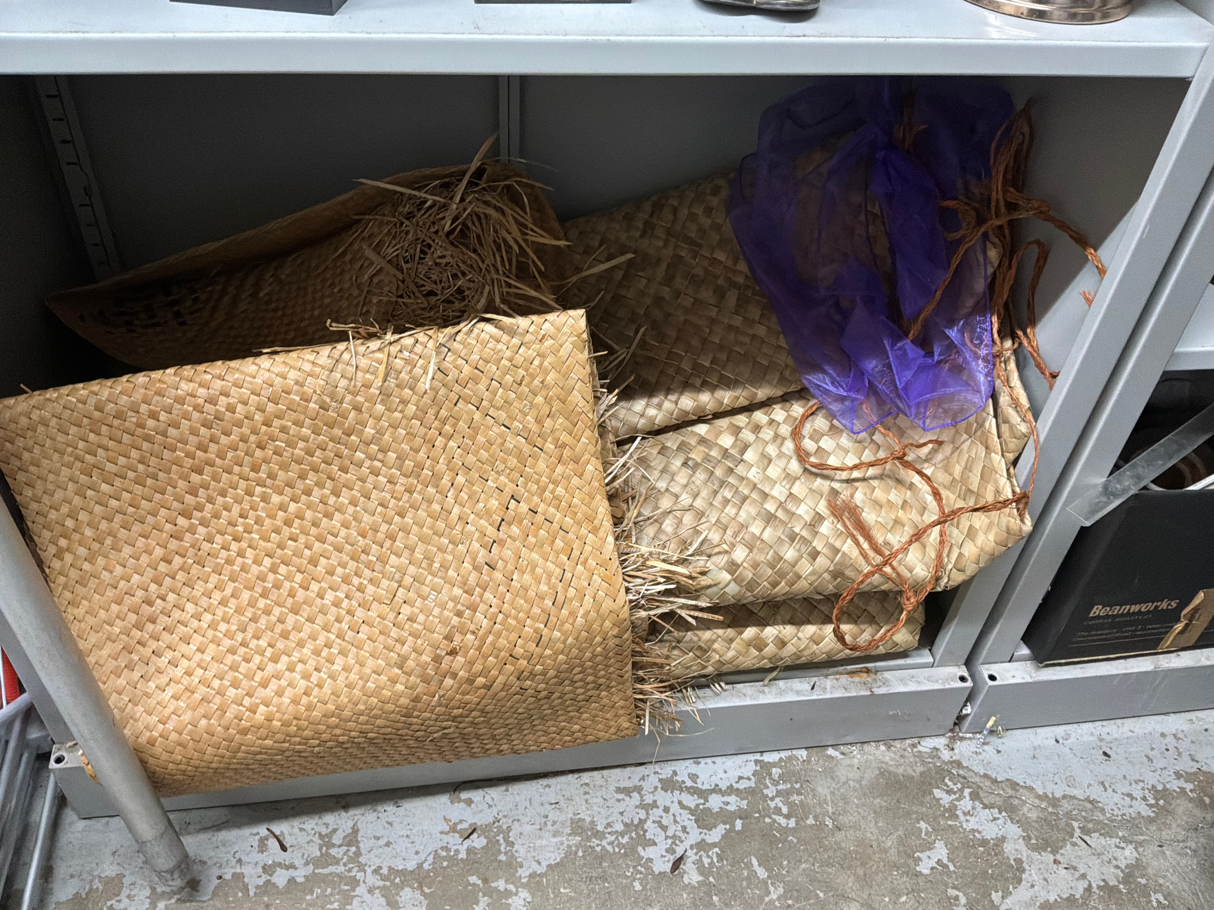 A Collection of Polynesian style Hand Woven Pandanus Leaf Mats Including Tufted Examples