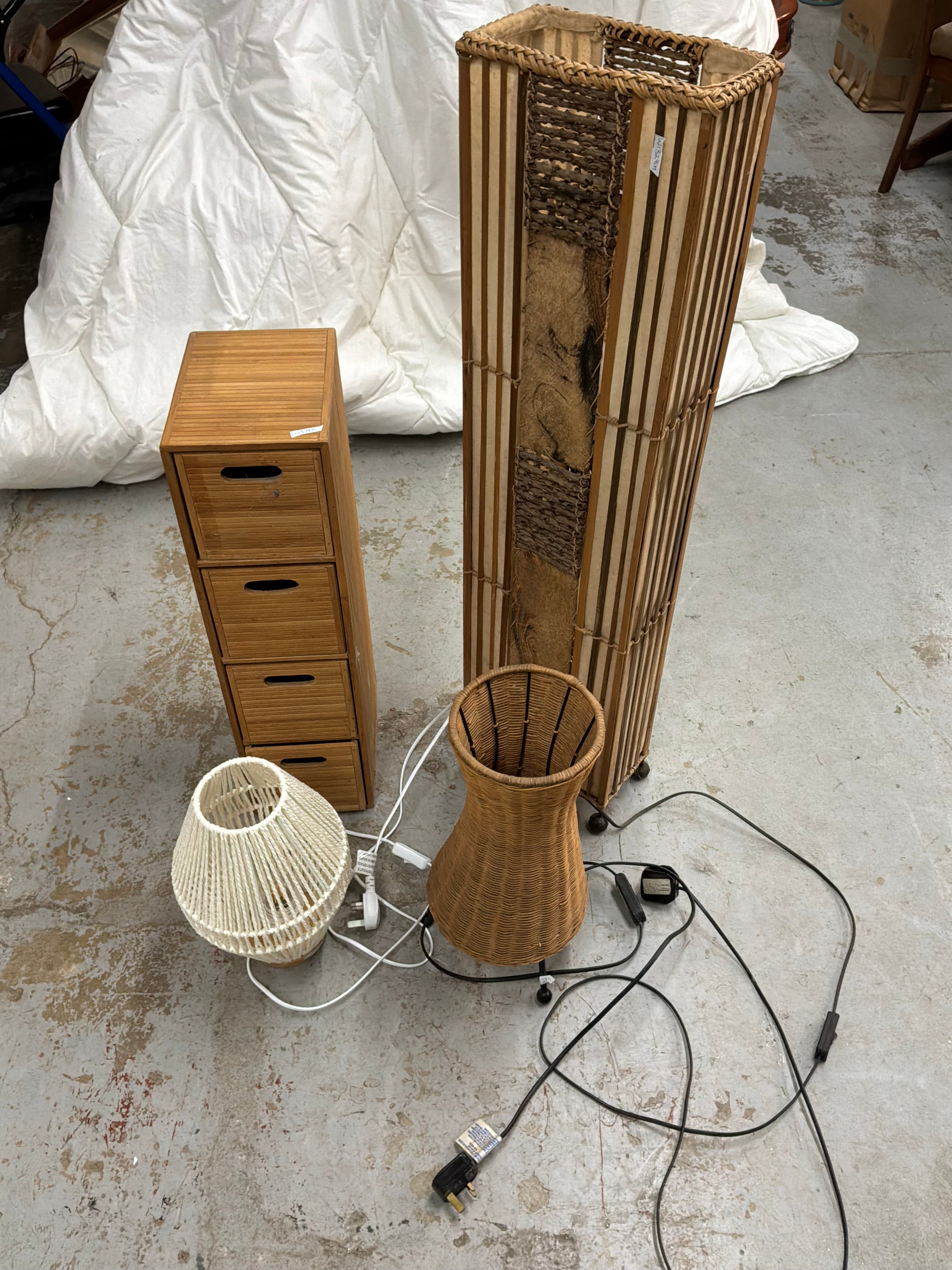 An Assortment of Contemporary Natural Material Table and Floor Lamps and a Bamboo style Storage Chest