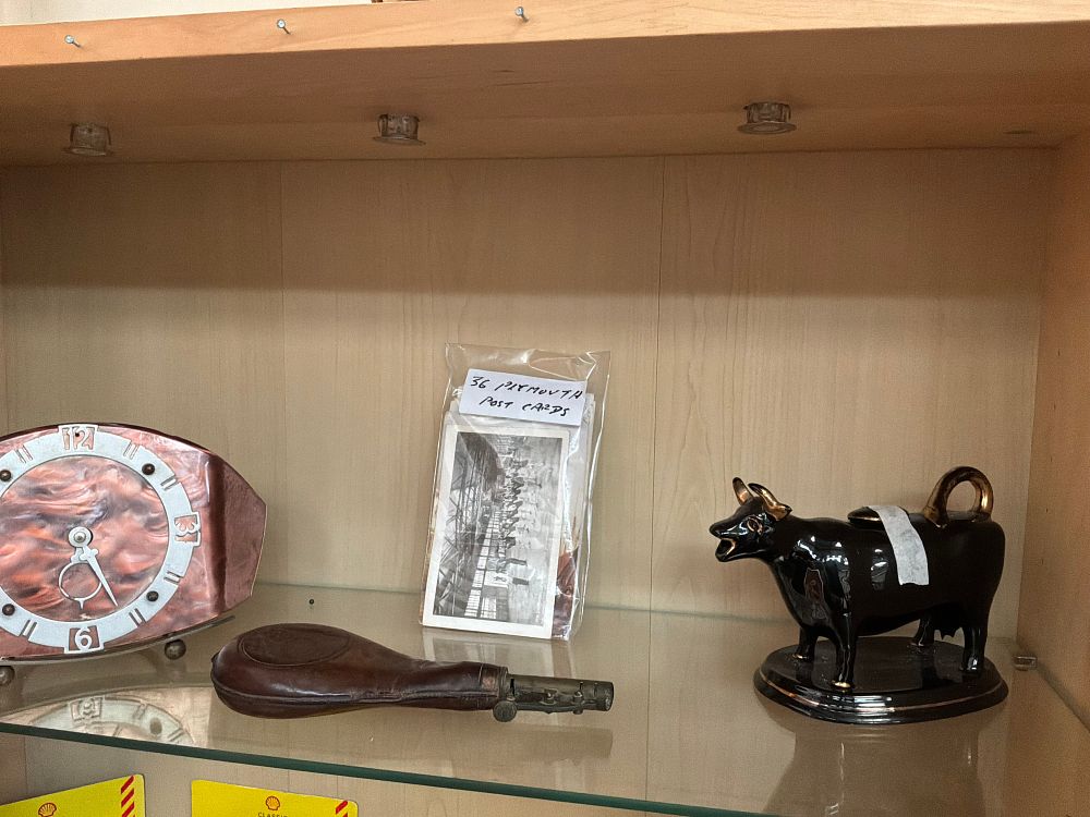 Lot 164: A Collection of Antique and Vintage Collectibles Including a Leather Shot Flask and Art Deco Mantel Clock