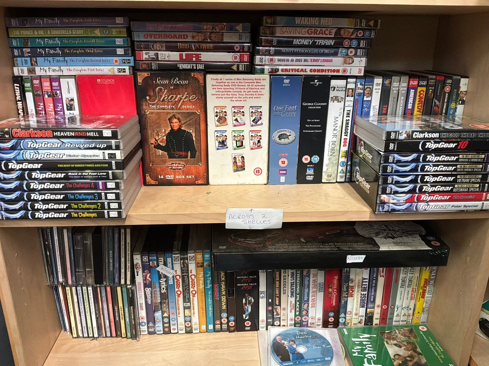 Lot 170: A Collection of DVDs and Compact Discs including Sharpe and Men Behaving Badly Box Sets