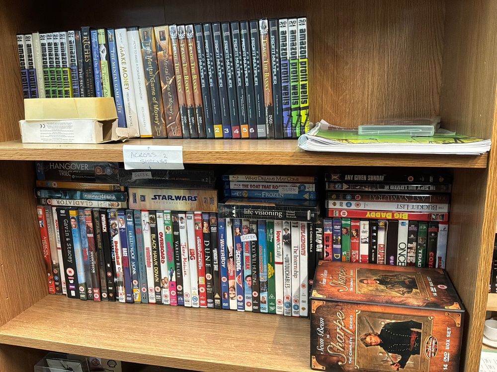 Lot 174: A Large Collection of DVD Media Including Sharpe The Complete Series and Star Wars The Complete Saga