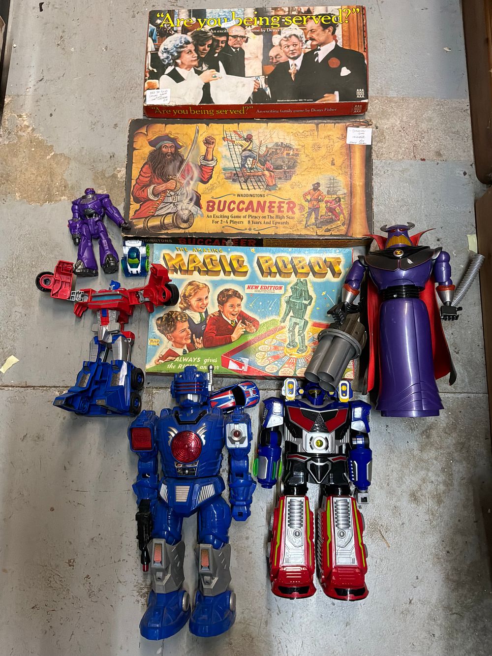 Lot 198: A Collection of Vintage Board Games and Plastic Action Figures Including Waddingtons and Merit Examples