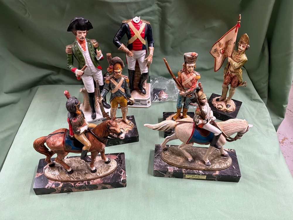 Lot 201: A Collection of Seven Napoleonic Style Polychrome Porcelain Military Figurines on Carrara Marble Bases