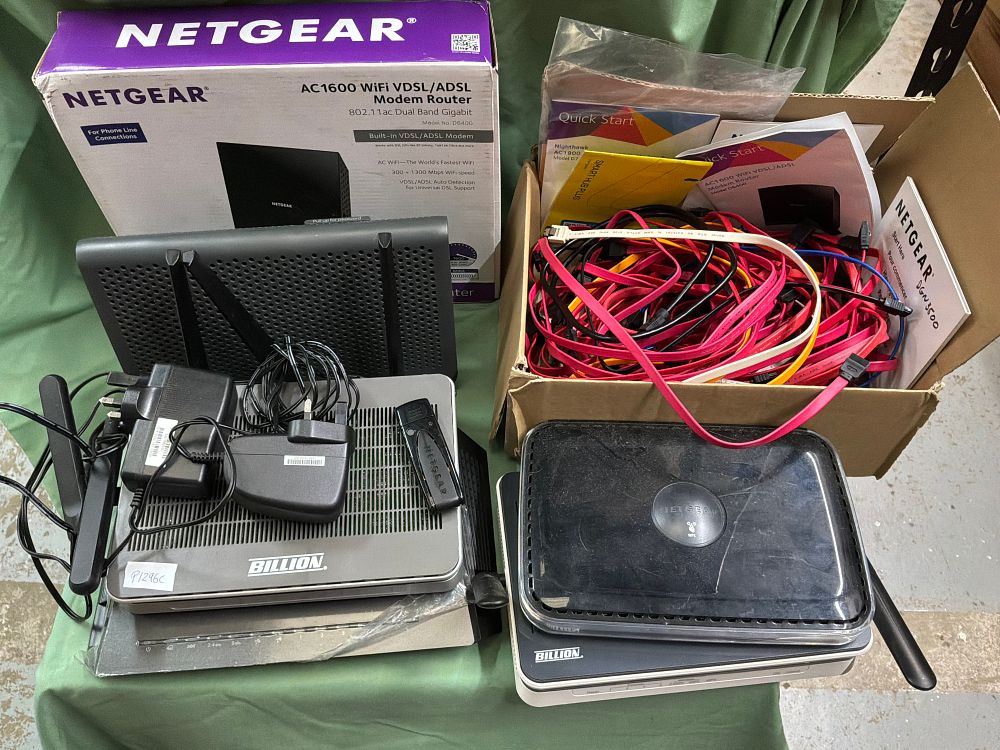 Lot 203: A Collection of Networking Equipment Including Netgear and Billion Examples