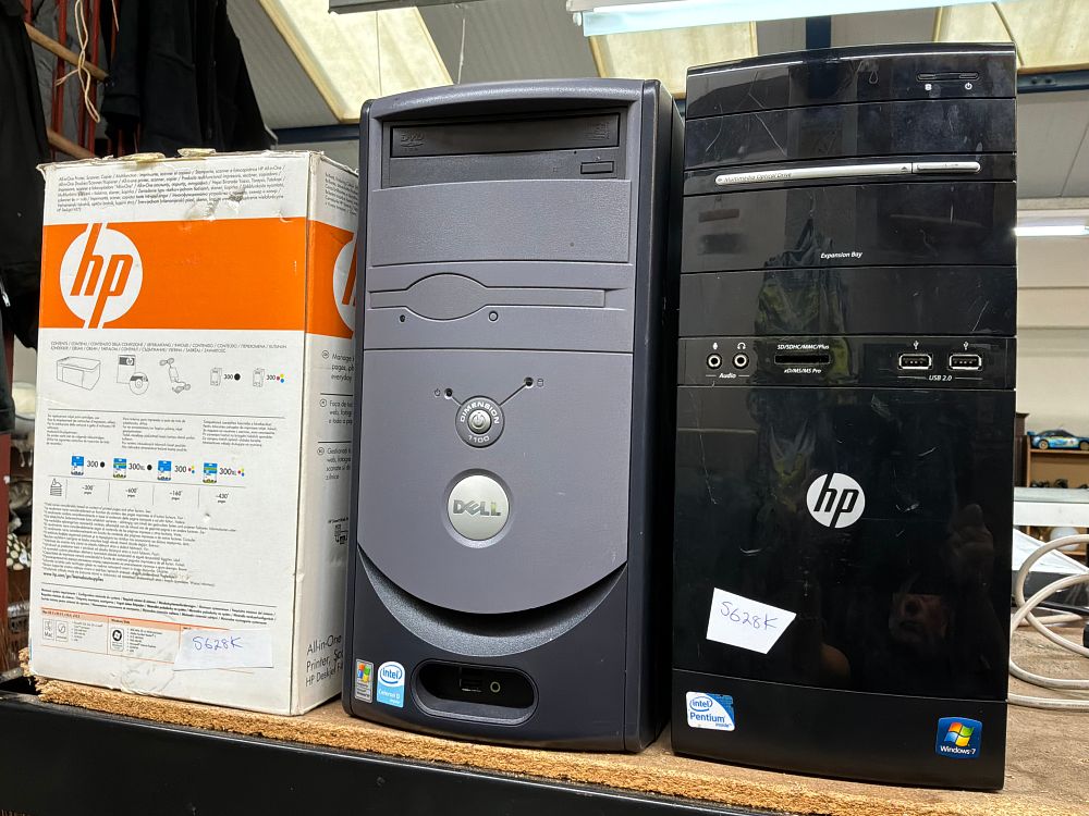 Lot 206: A Group of Two Desktop Computer Towers and a Boxed HP All-in-One Printer
