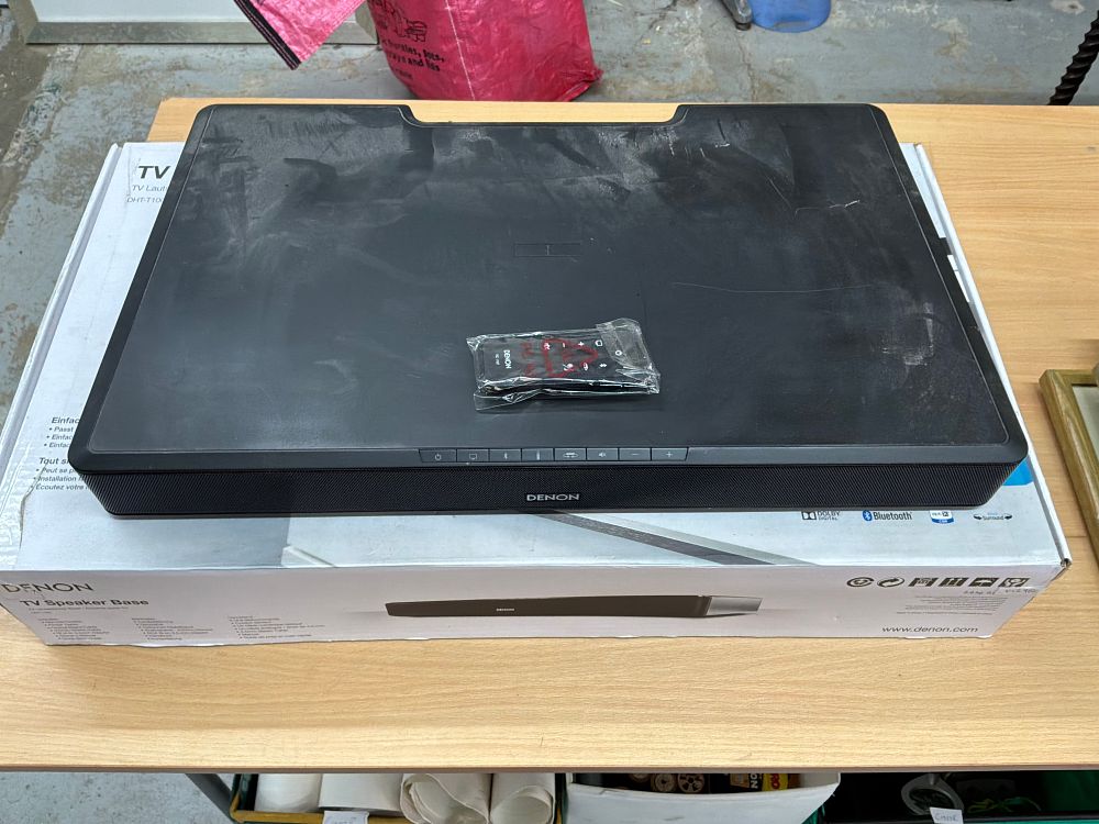 Lot 213: A Denon DHT-T100 TV Speaker Base with Remote Control in Original Box