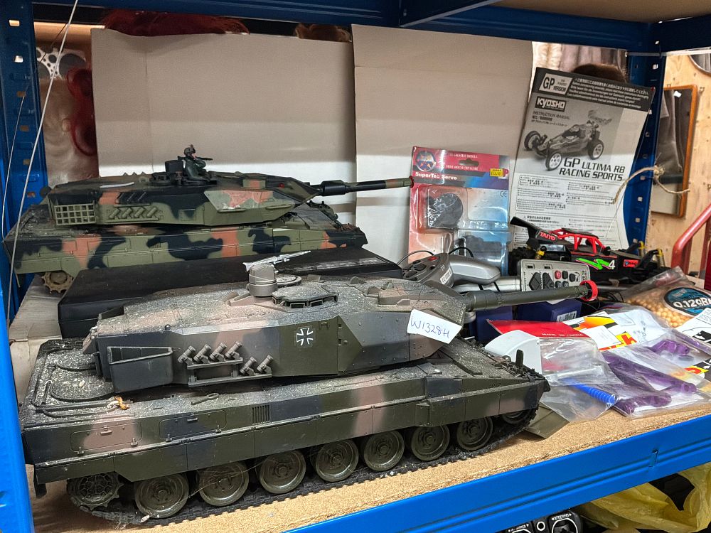 Lot 214: A Collection of Remote Control Vehicles and Hobbyist Components including RadioShack and Schumacher Examples
